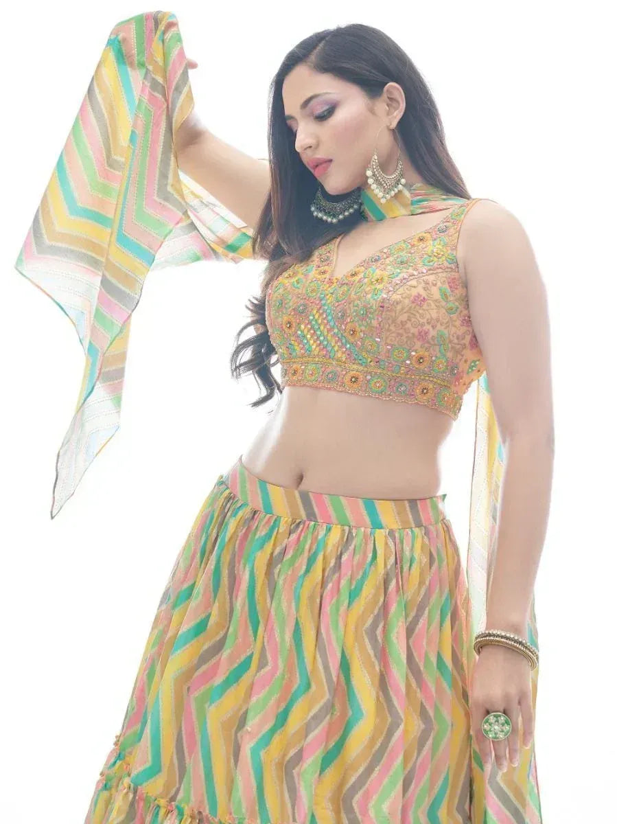 Woman in colorful embroidered lehenga choli with zigzag print skirt and dupatta, Indian ethnic wear