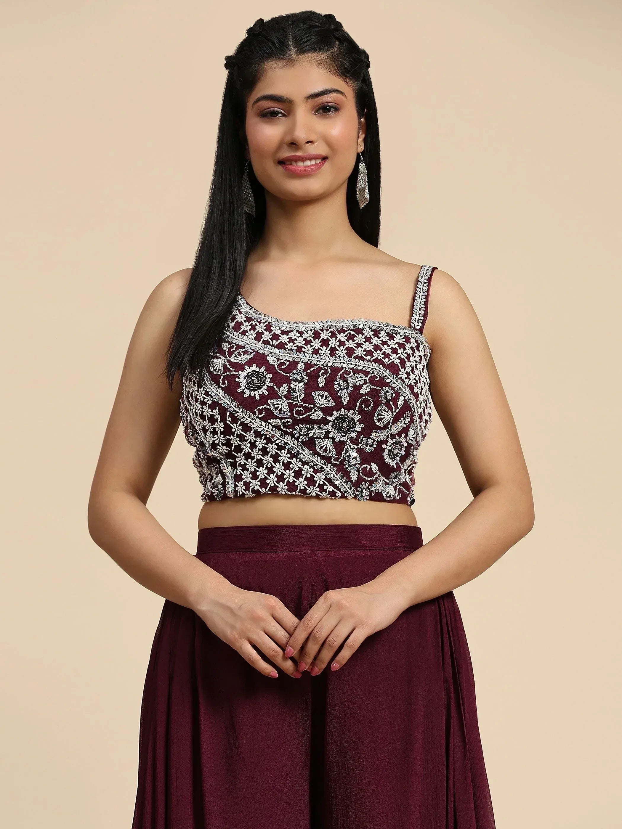 Maroon embroidered crop top with floral zari work paired with matching skirt, perfect for Indian ethnic wear occasions.