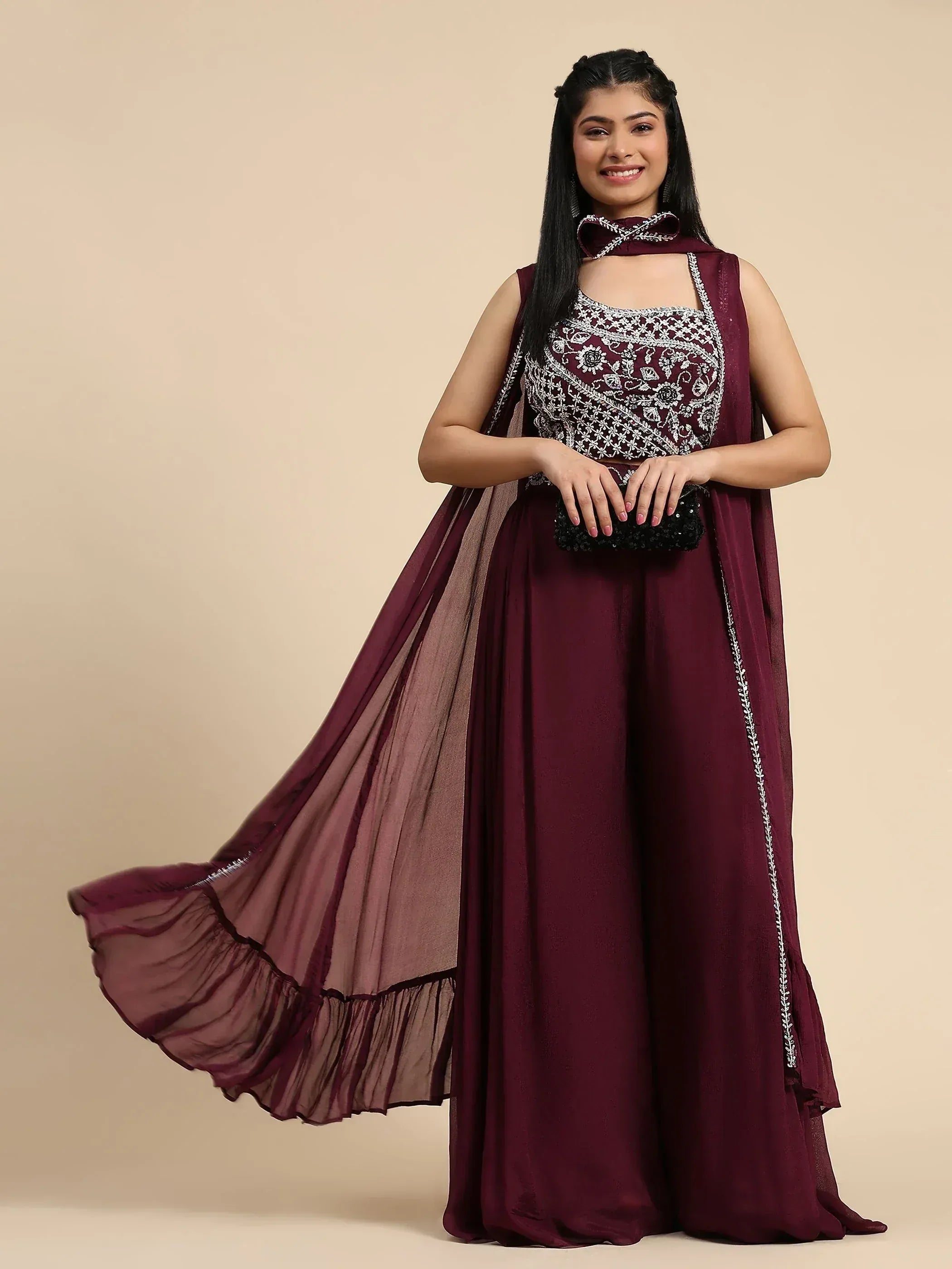 Burgundy ethnic gown with silver embroidery and flowing dupatta, perfect for Indian weddings and parties