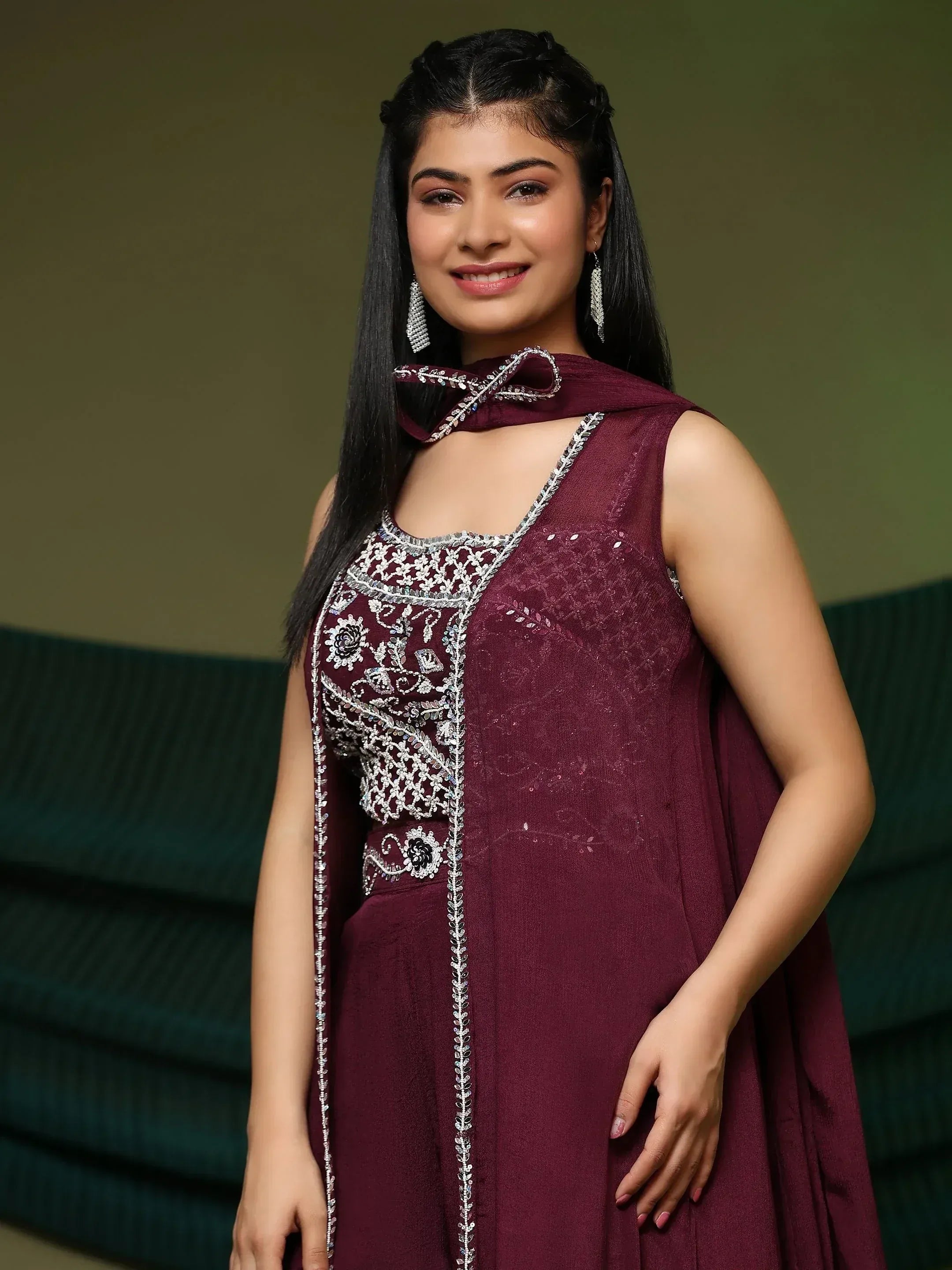 Maroon ethnic gown with silver embroidery and bow neck design
