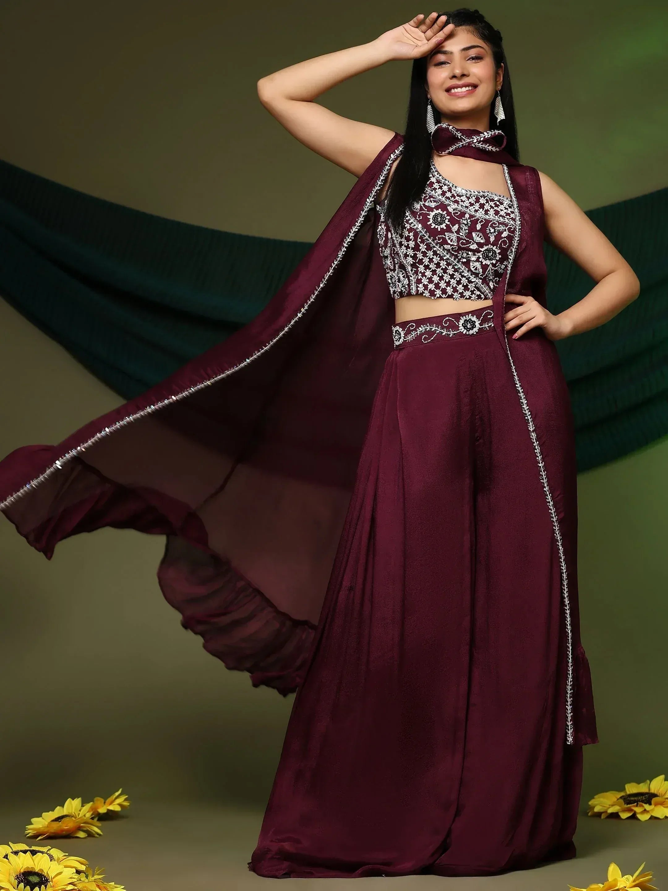 Elegant maroon ethnic lehenga choli with silver embroidery, perfect for Indian weddings and festive occasions.