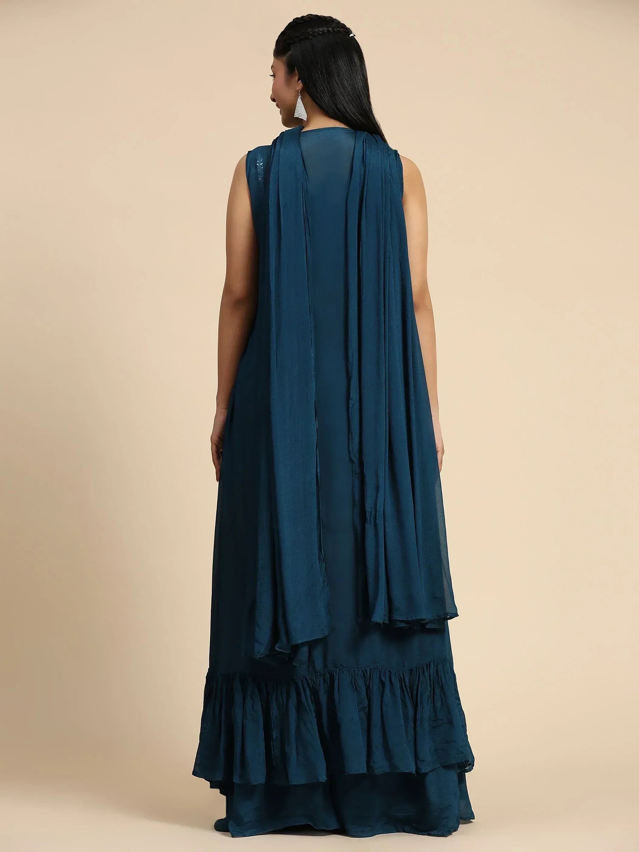 Teal blue ethnic gown with ruffled hem and draped back, perfect for Indian occasions