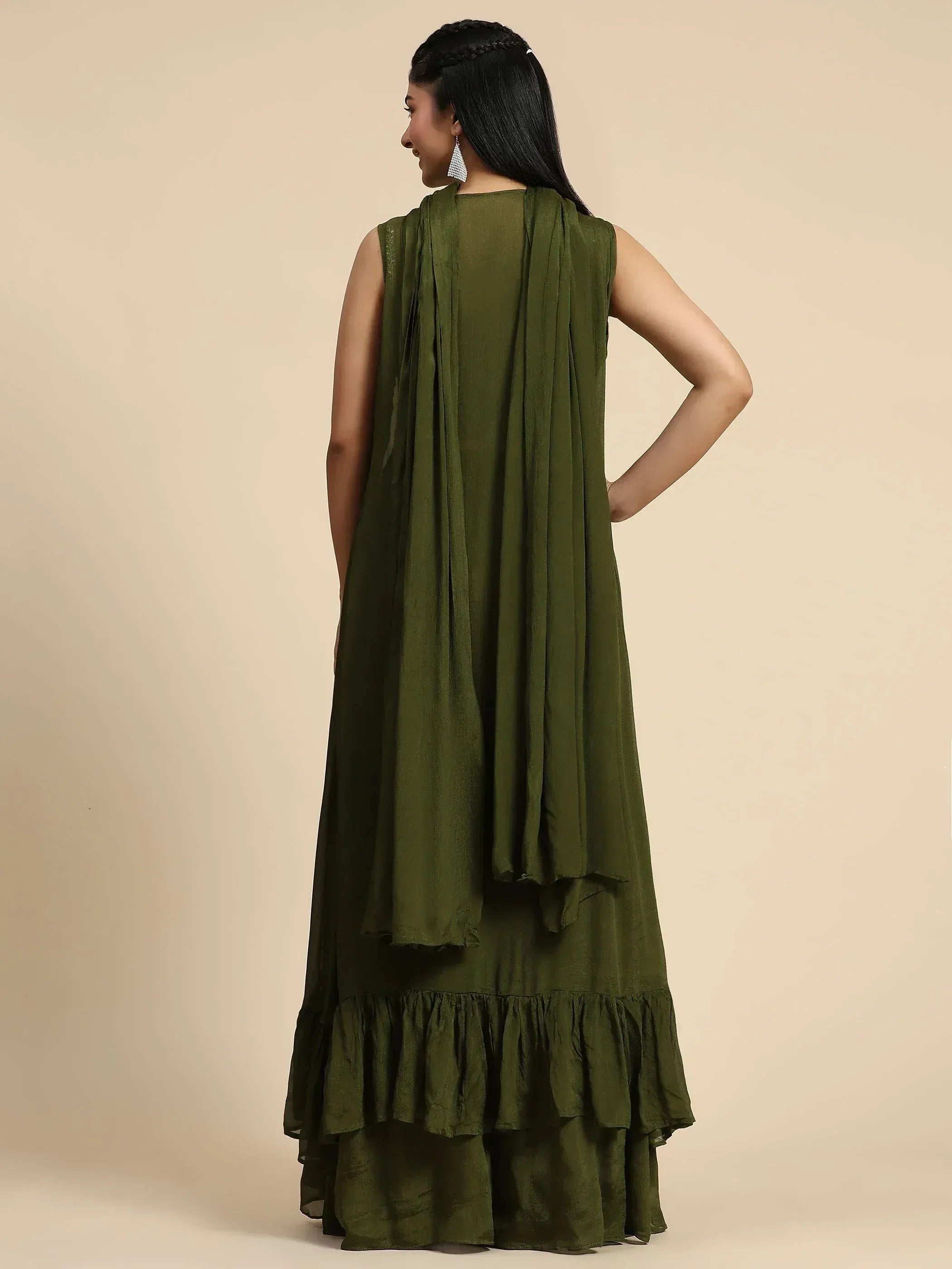 Olive green sleeveless ethnic gown with ruffled hem and draped back, perfect for Indian wear