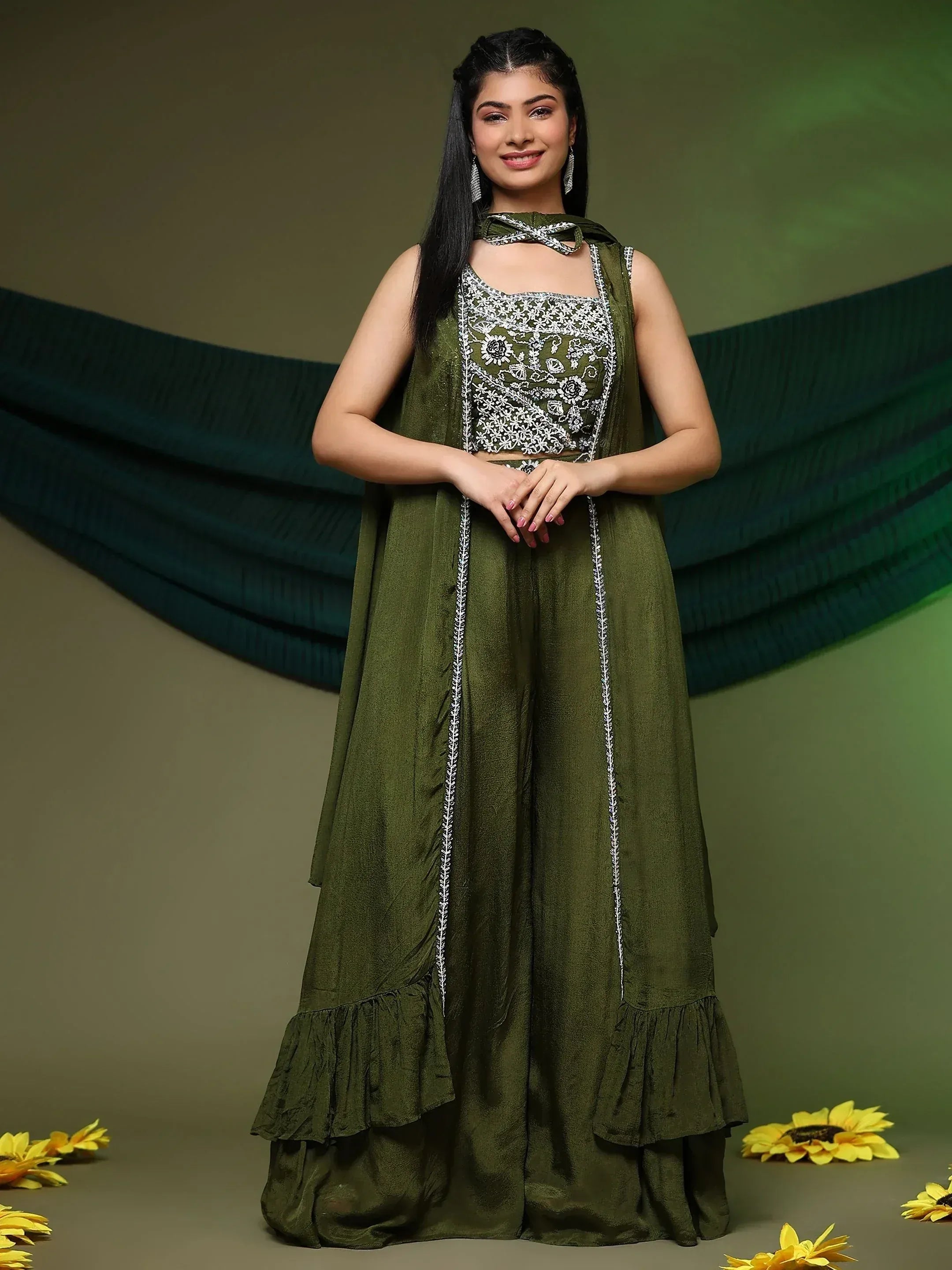 Olive green embroidered ethnic gown with floral detailing and ruffled hem, styled with matching dupatta