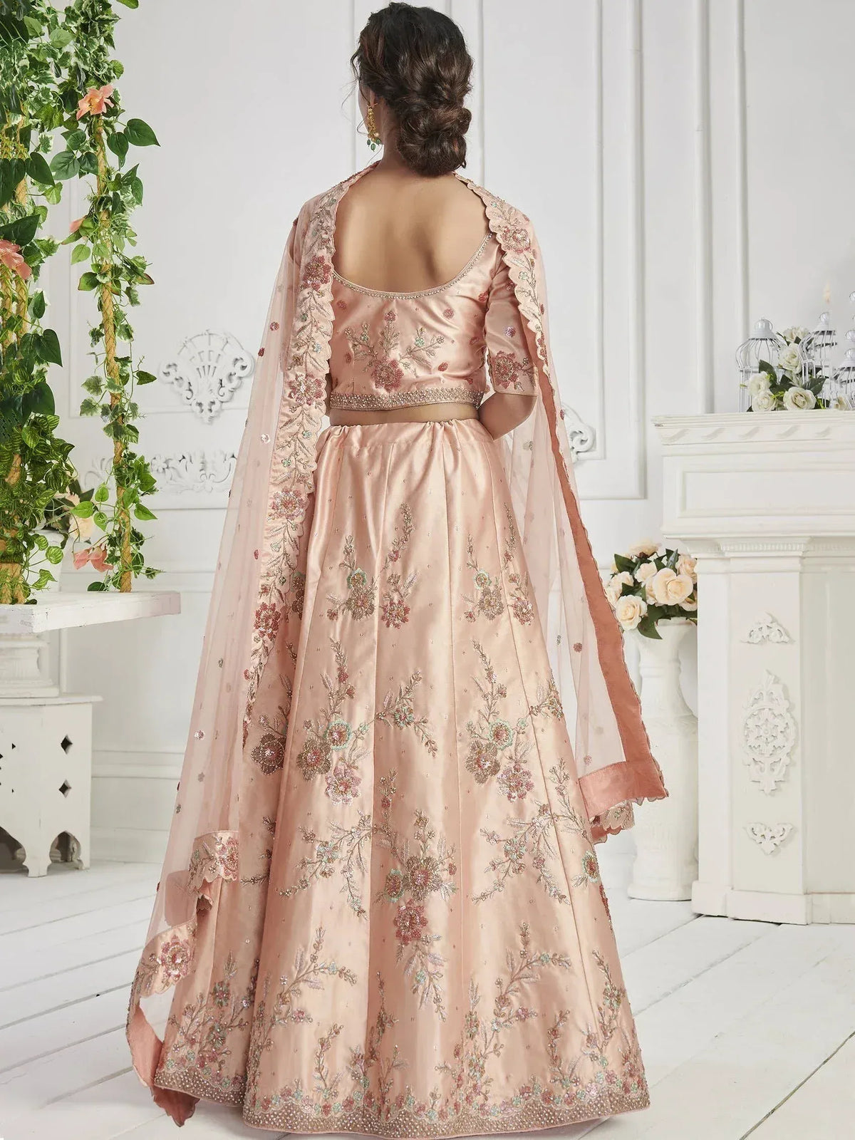 Pink floral embroidered lehenga choli with sheer dupatta, back view