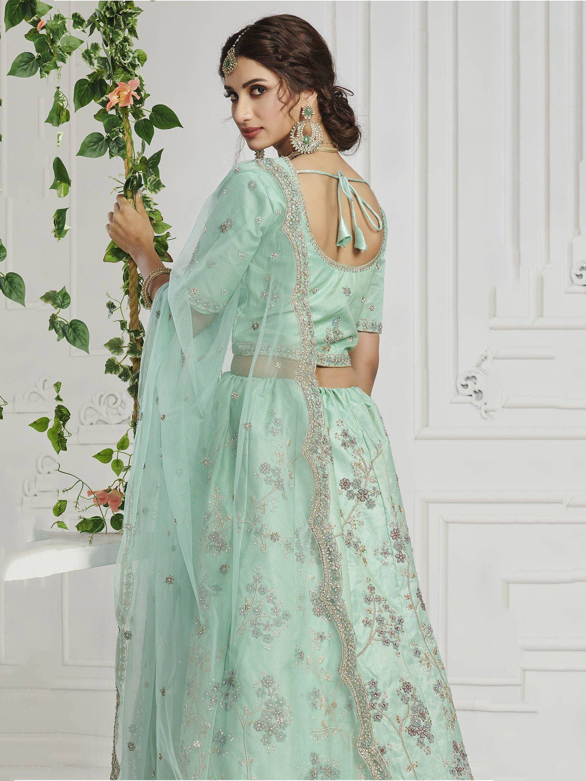 Mint green embroidered lehenga choli with back tie detail, perfect for Indian ethnic wear occasions