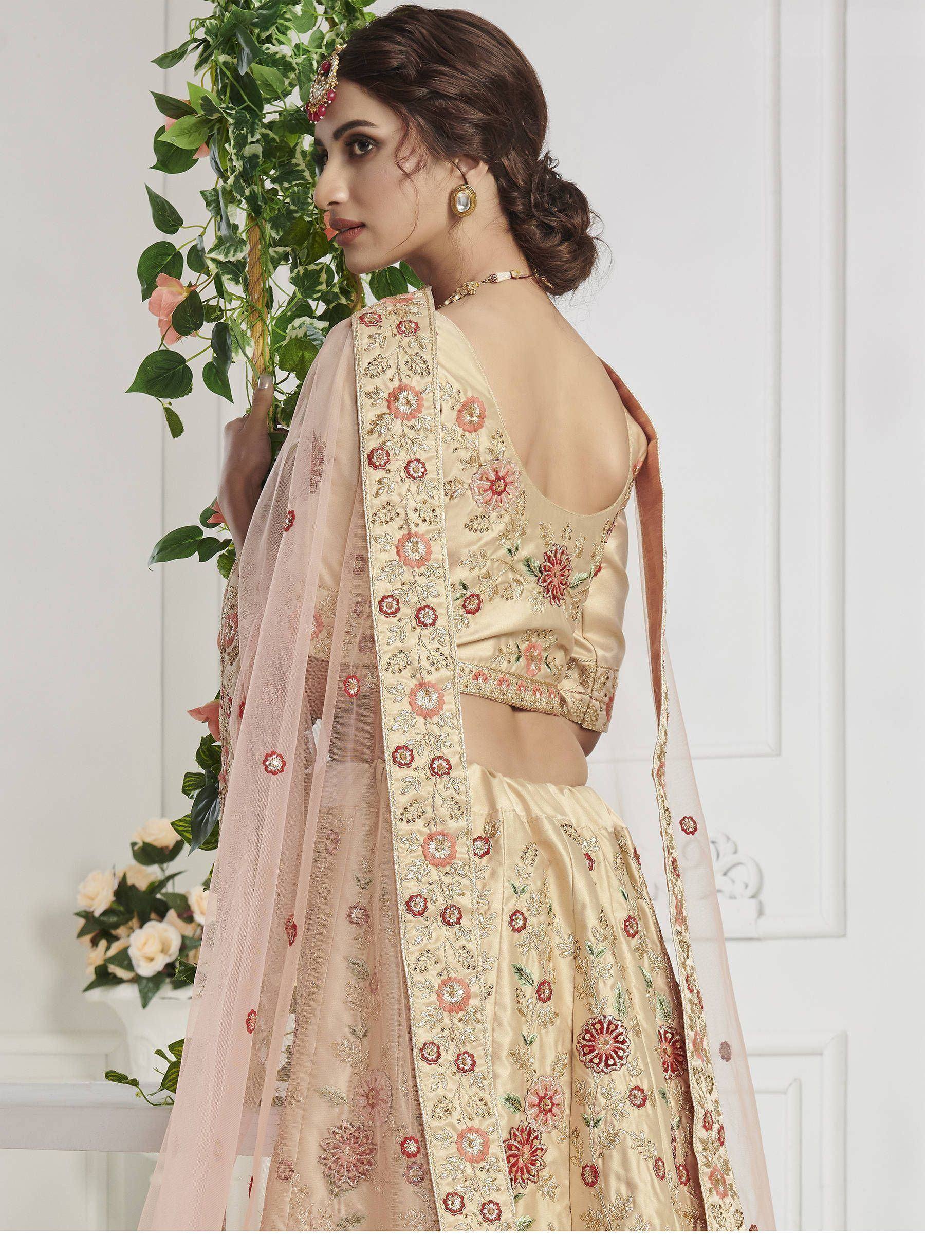 Elegant beige floral embroidered lehenga choli with sheer dupatta, perfect for Indian ethnic occasions.