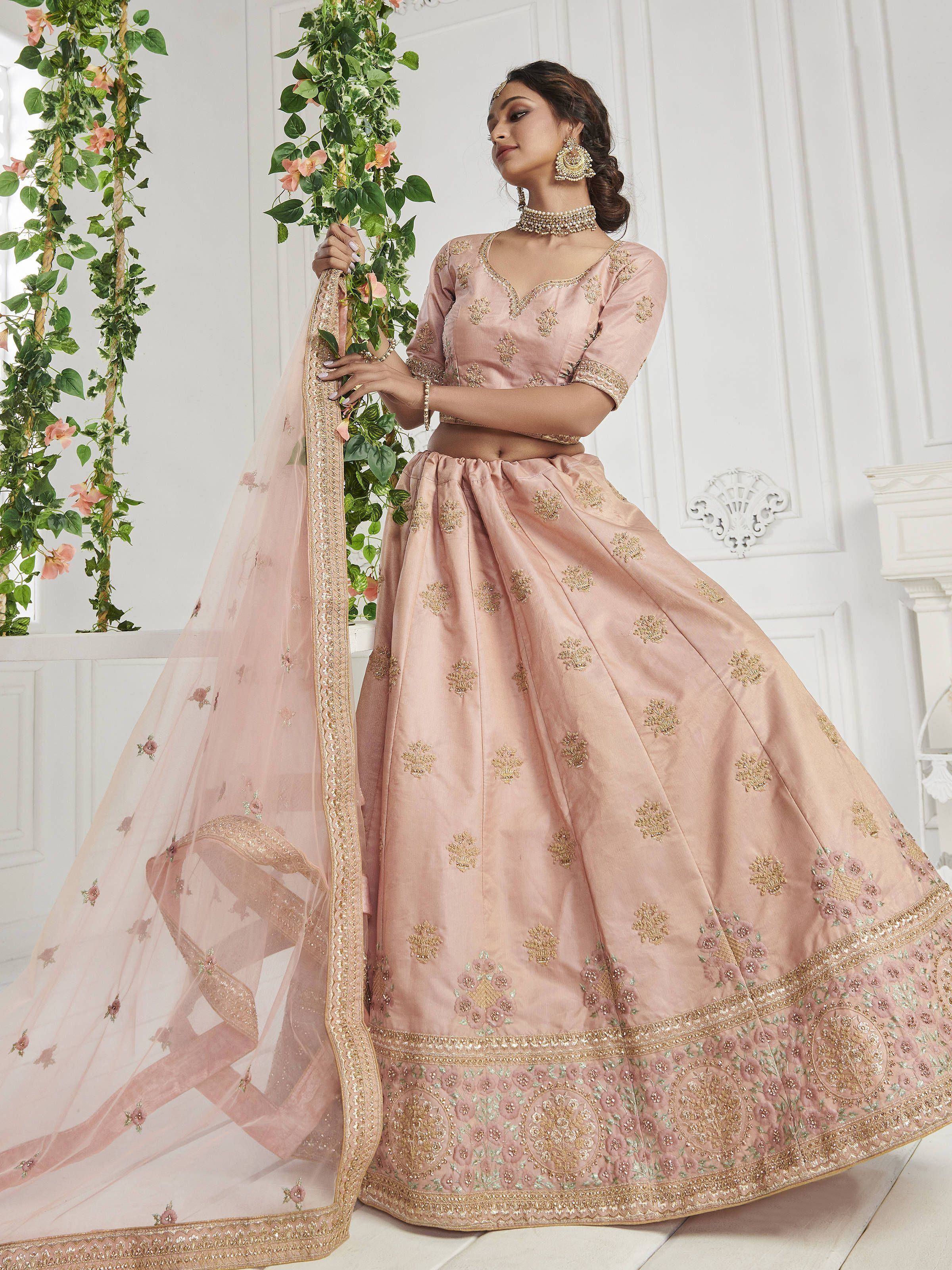 Pink embroidered lehenga choli with gold detailing, perfect for Indian weddings and festive occasions