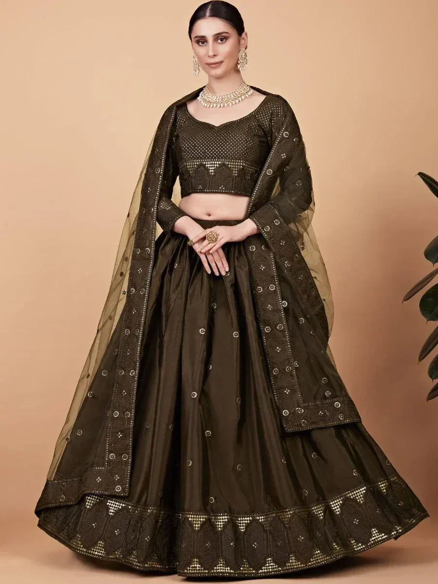 Olive green designer lehenga choli with intricate embroidery and sheer dupatta for Indian ethnic wear