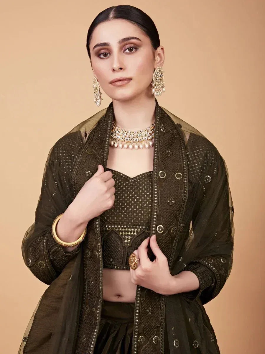 Elegant olive green embroidered lehenga choli with sheer jacket, perfect for Indian ethnic wear occasions.
