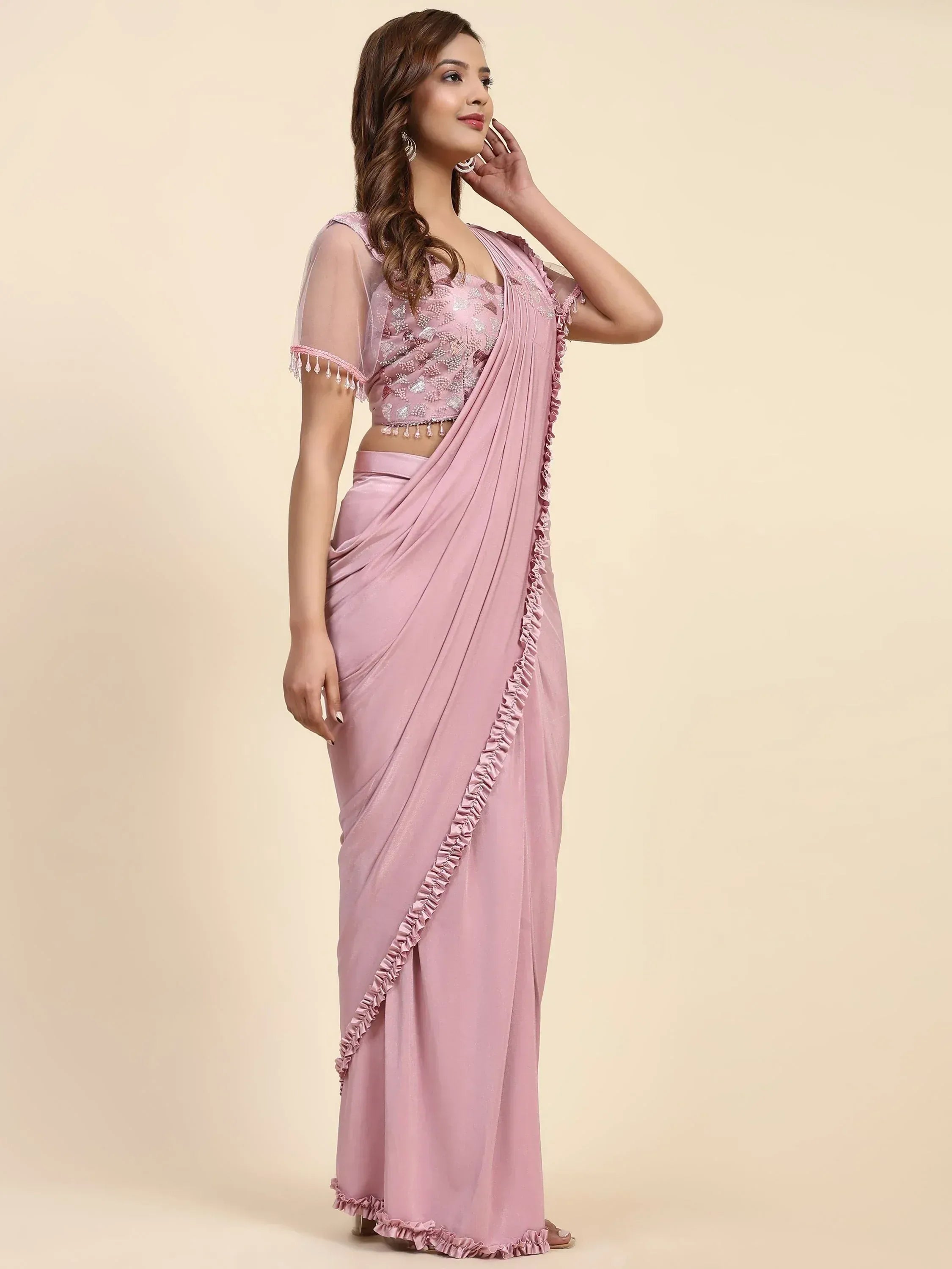Pink designer saree with ruffle trim and embellished blouse, ethnic wear for women