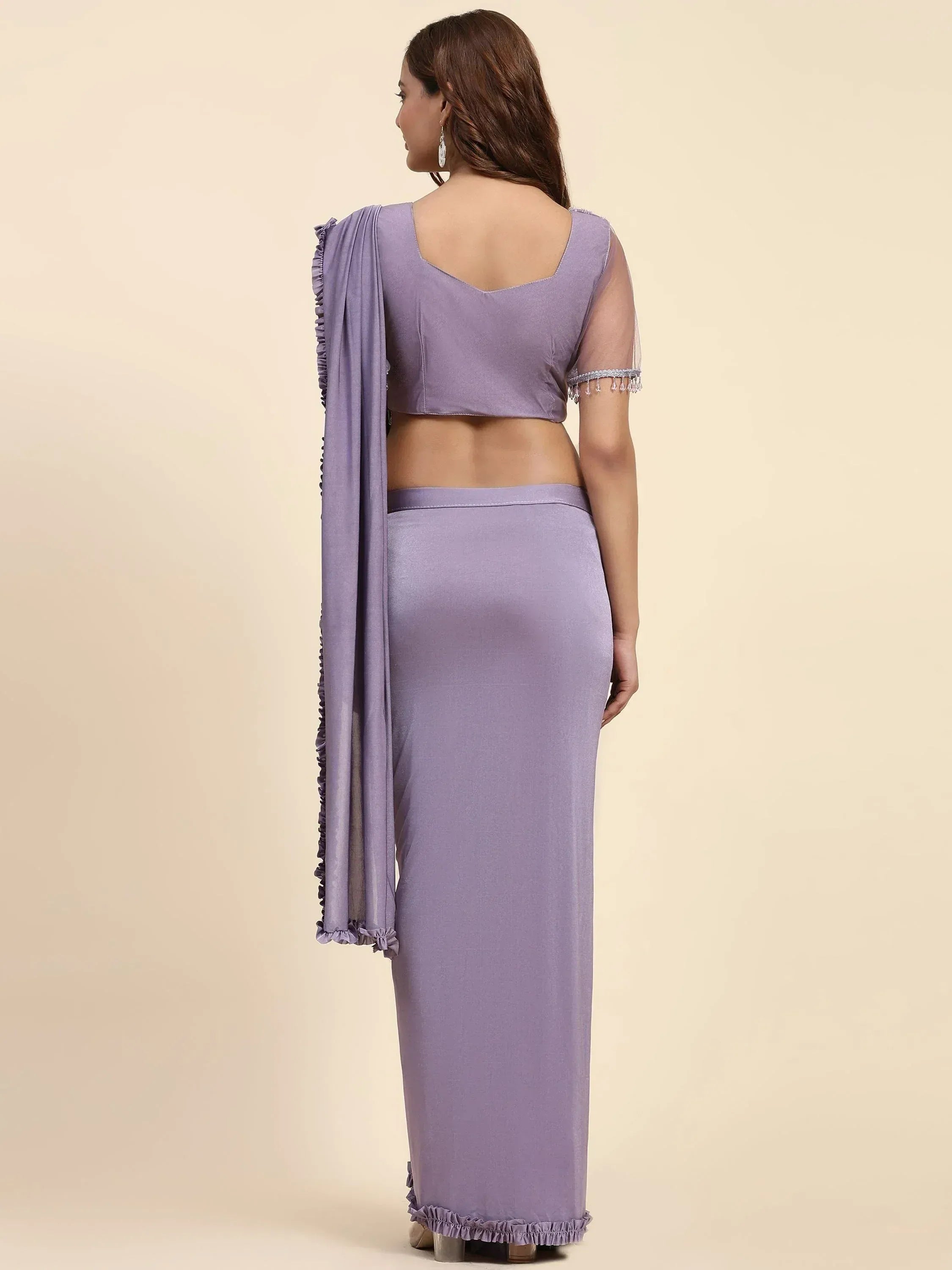 Lavender ethnic gown with ruffled dupatta and sheer sleeves, perfect for Indian occasions
