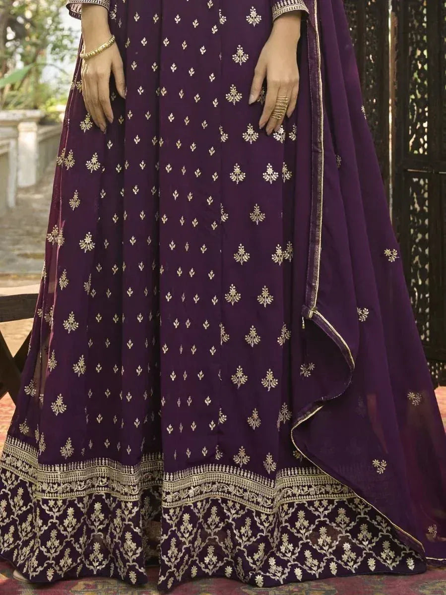 Purple ethnic gown with gold embroidery, perfect for Indian occasions and festive wear