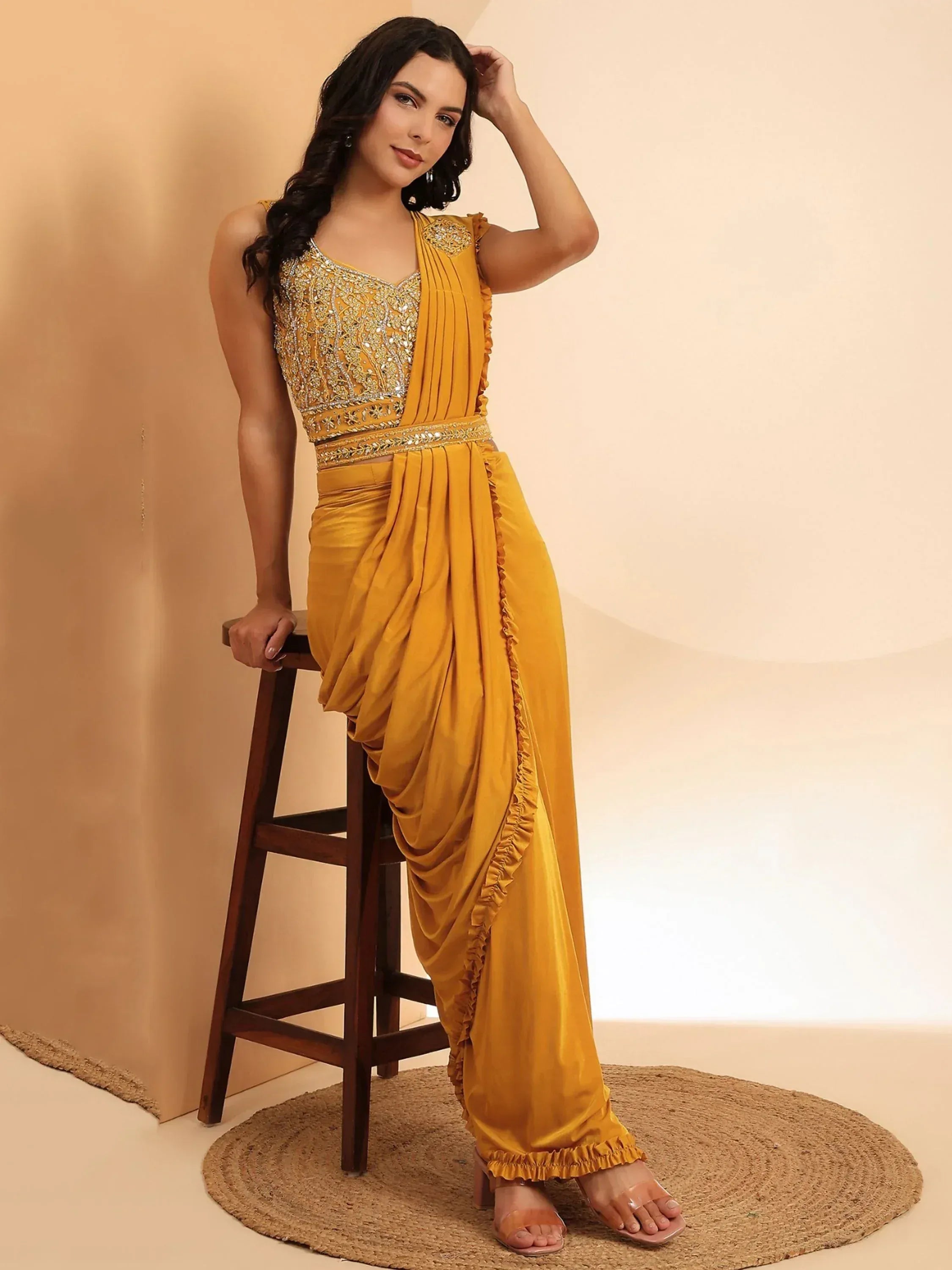 Mustard yellow ethnic gown with embroidered bodice and ruffled drape, perfect for Indian occasions