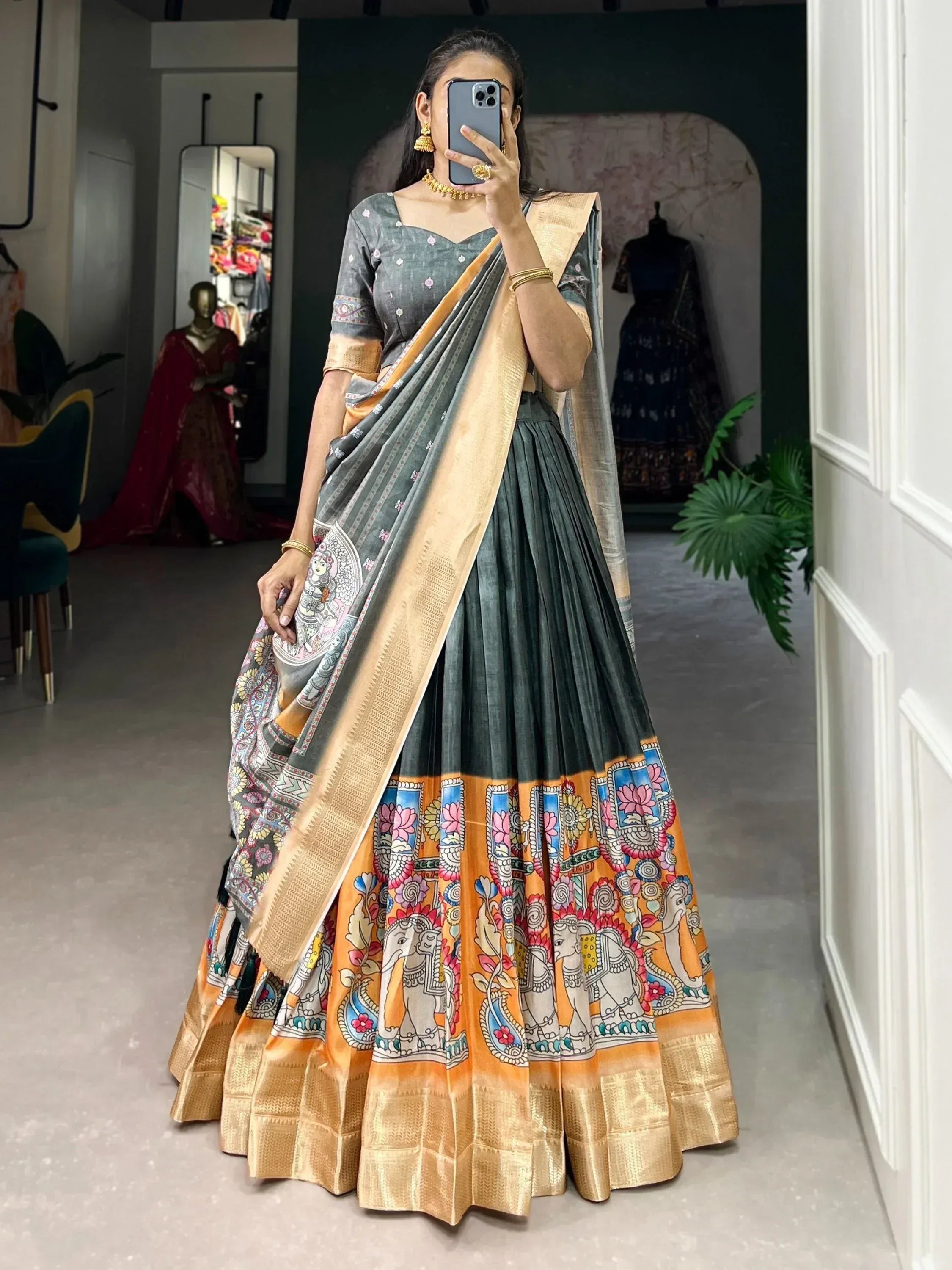 Grey and orange printed lehenga choli with elephant motifs, perfect for Indian ethnic wear occasions.