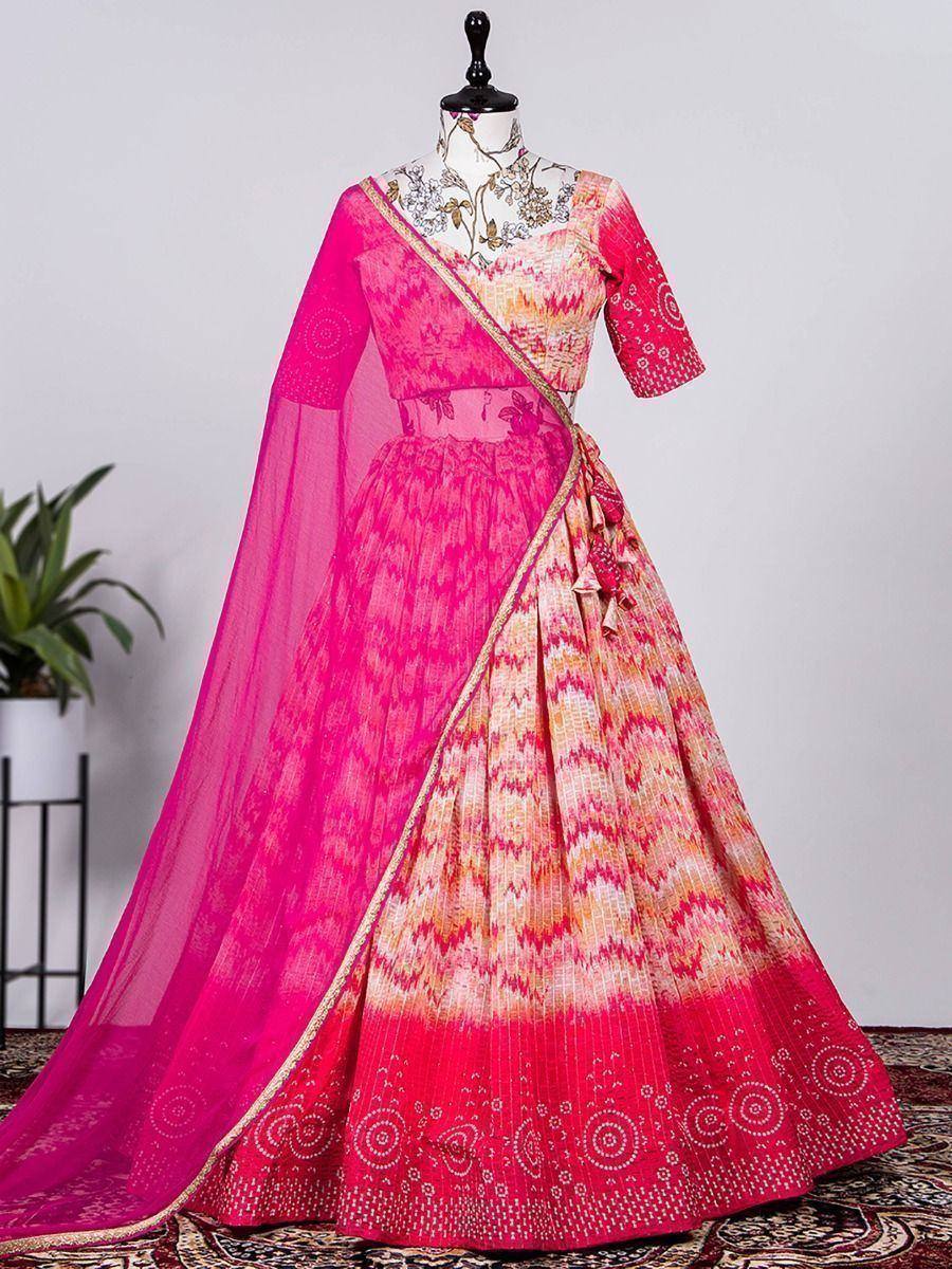 Pink and orange ikat print lehenga choli with sheer dupatta, ethnic Indian wear for weddings or festivals