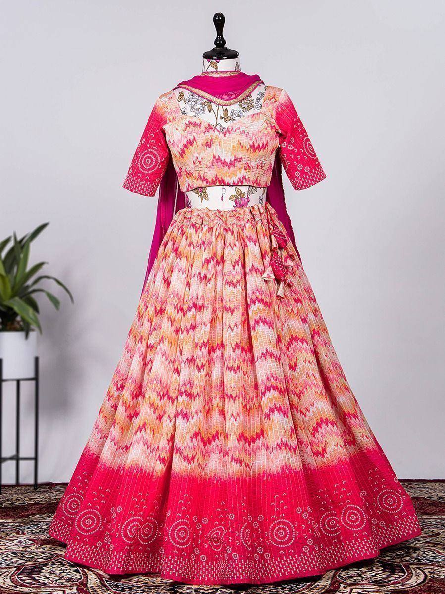 Pink and orange printed lehenga choli with floral embroidery and dupatta, ethnic Indian wear