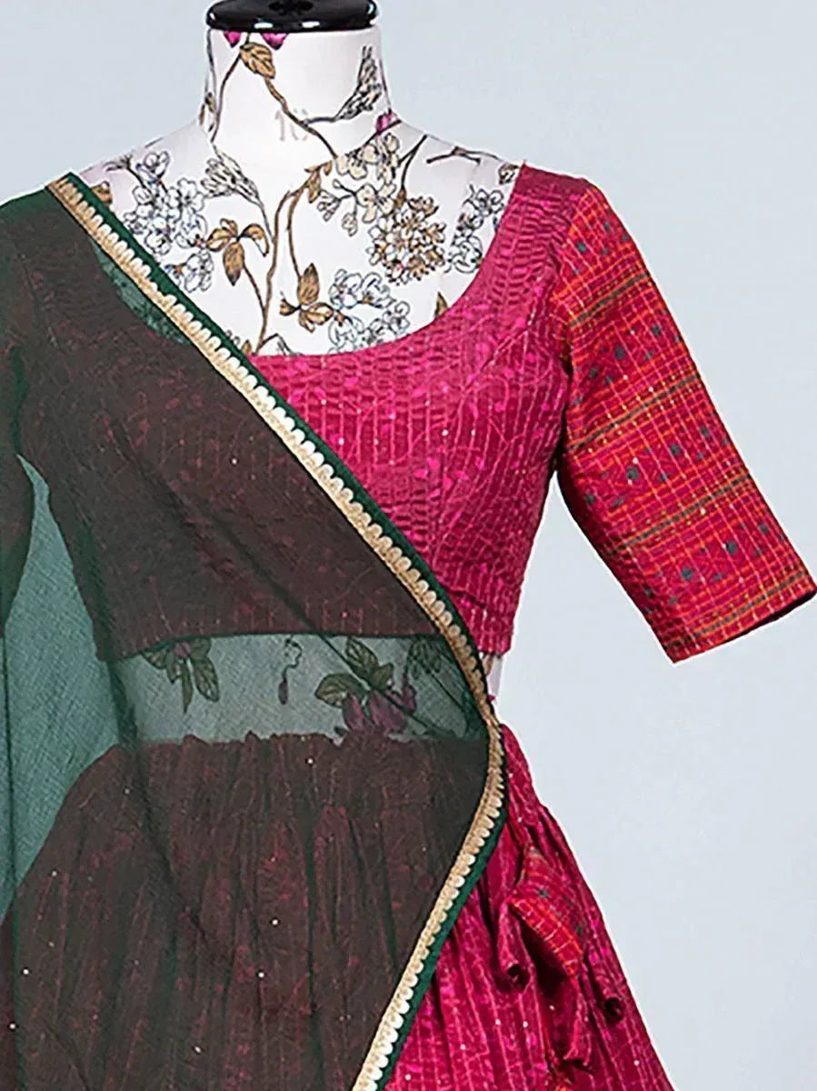 Pink and green ethnic saree with sequin blouse, floral mannequin display
