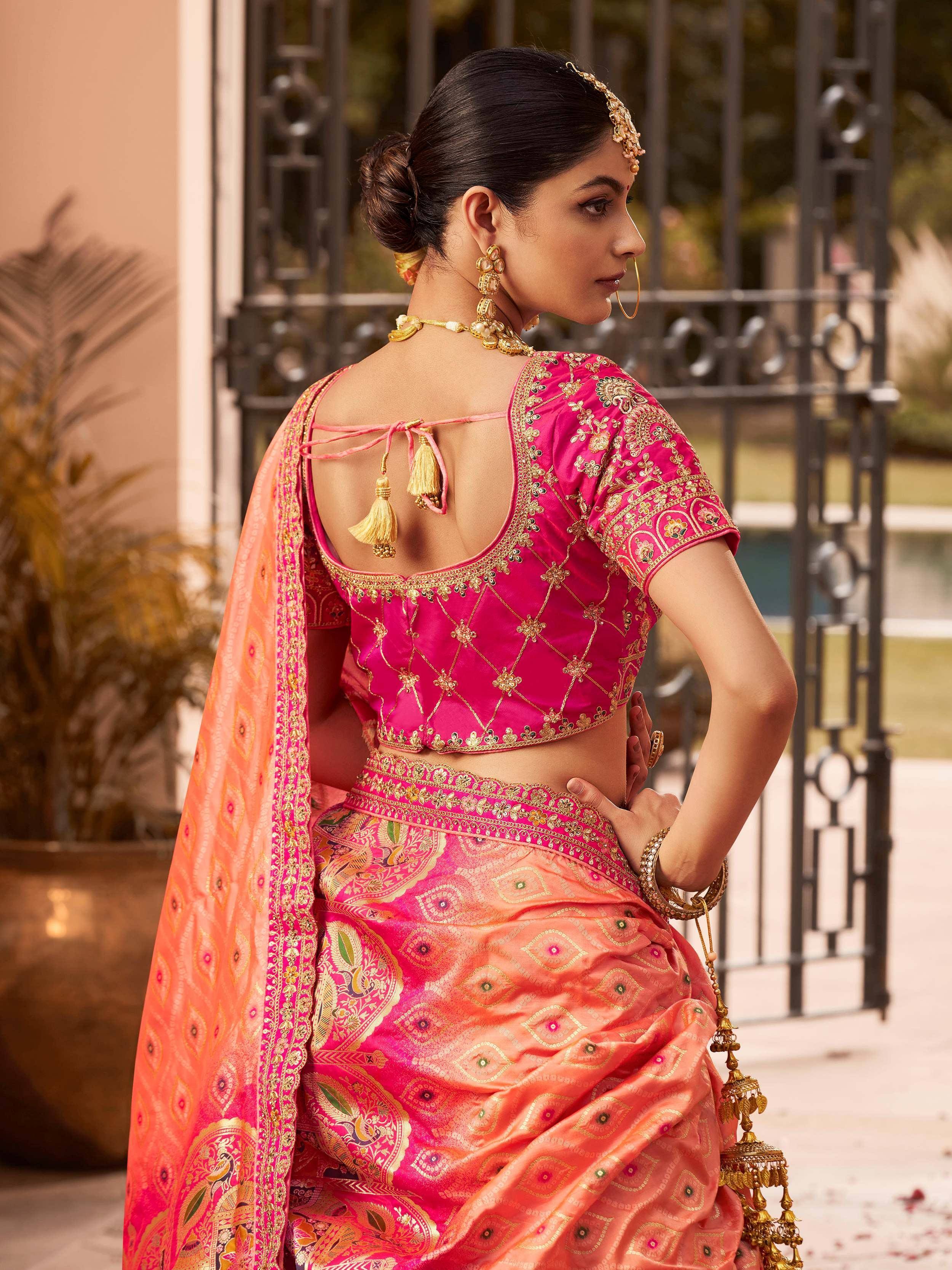 Pink and orange designer lehenga choli with gold embroidery, back view, ethnic wear