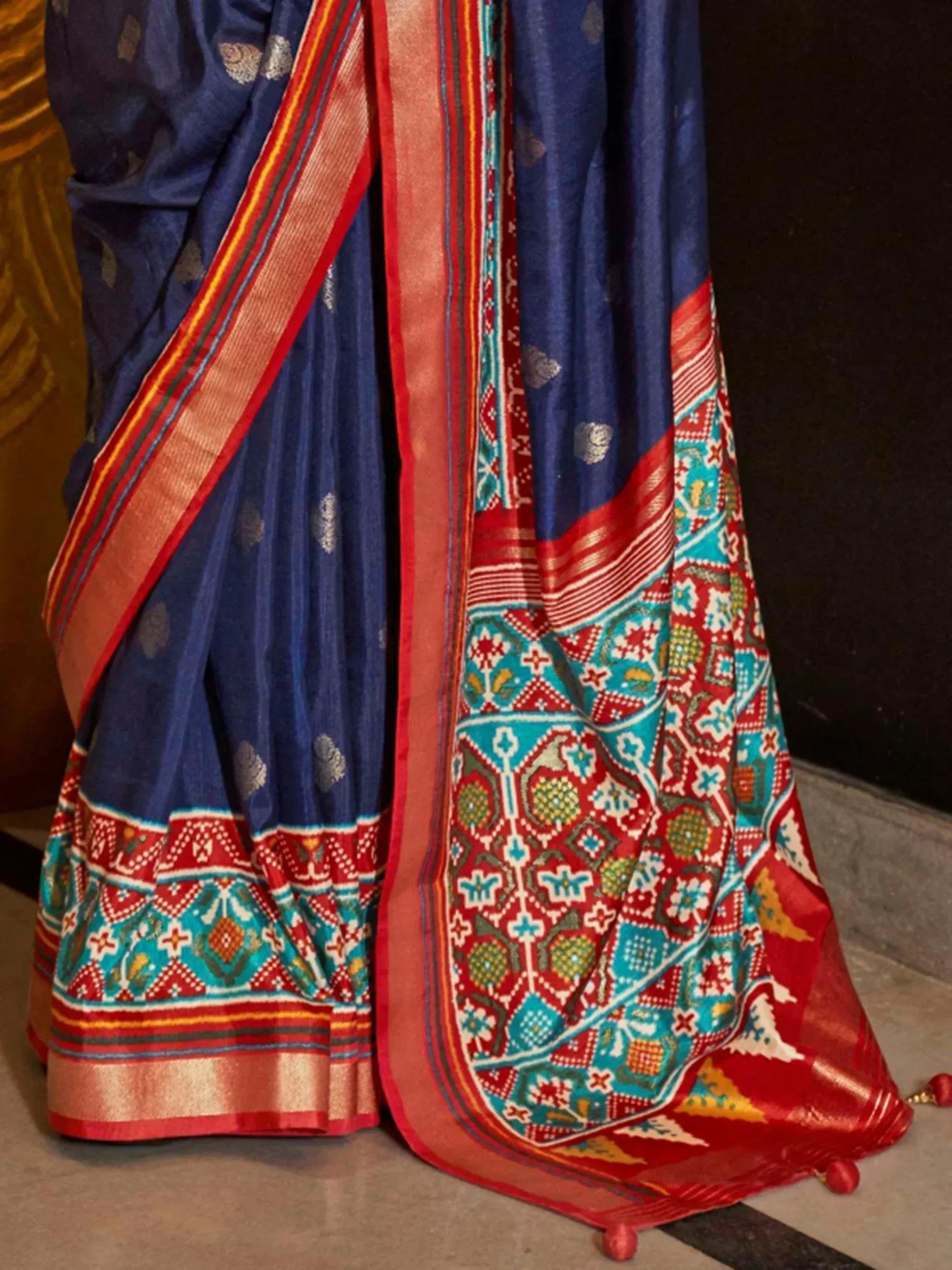 Blue ethnic saree with red and turquoise border, traditional Indian print, festive wear