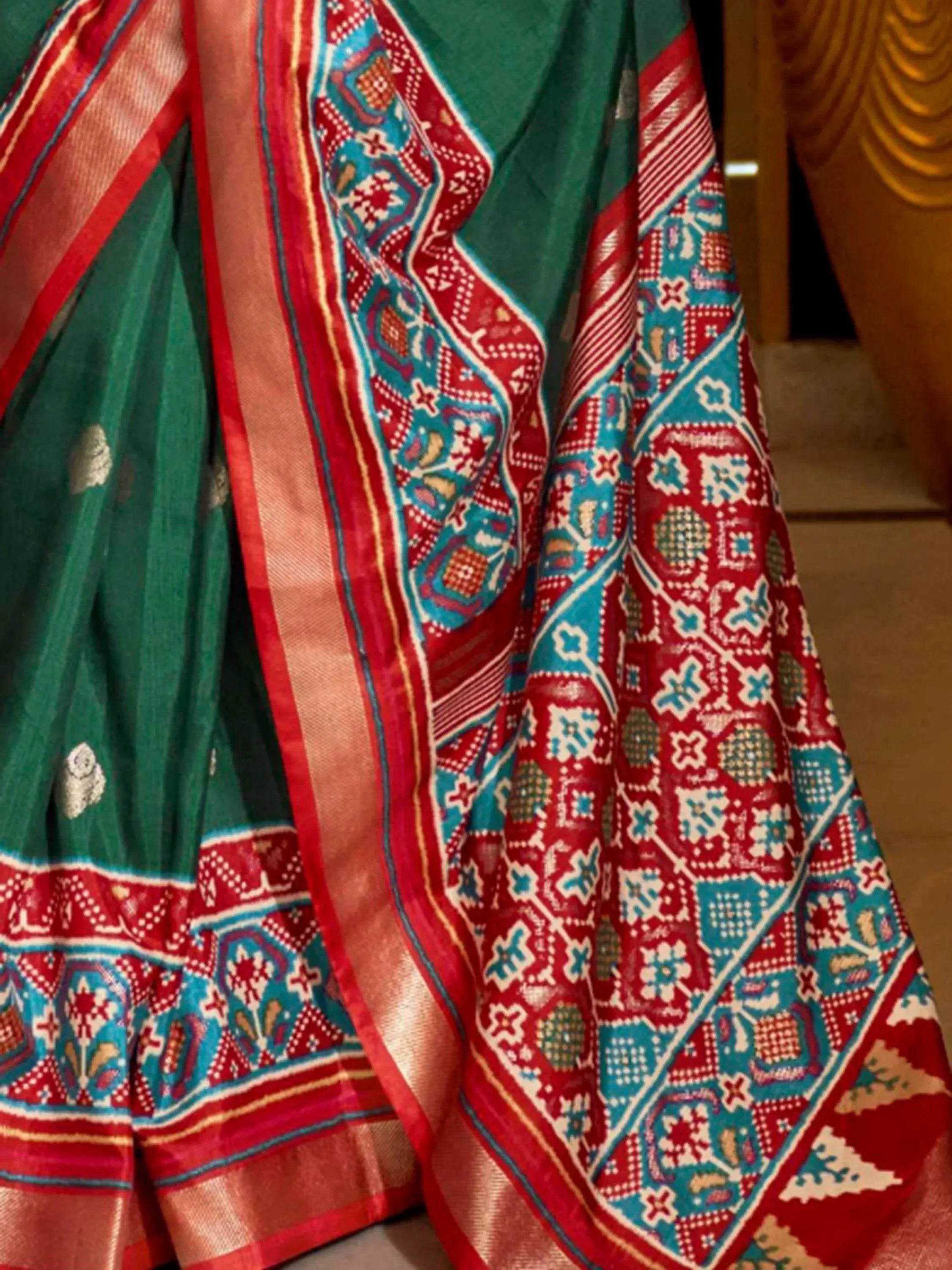 Green saree with red and blue geometric border, ethnic Indian wear