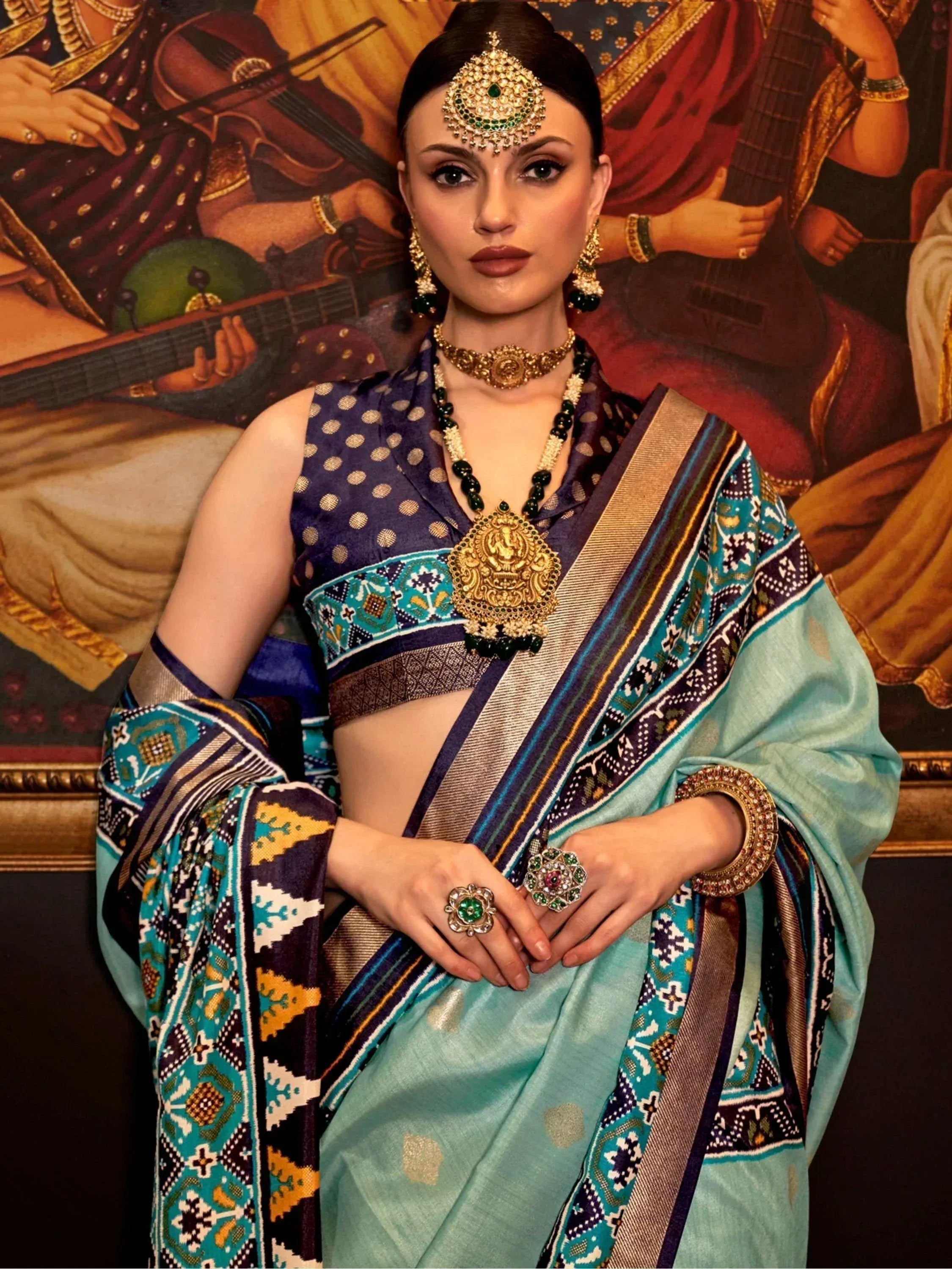 Woman in designer saree with gold jewelry, ethnic wear for festive occasions