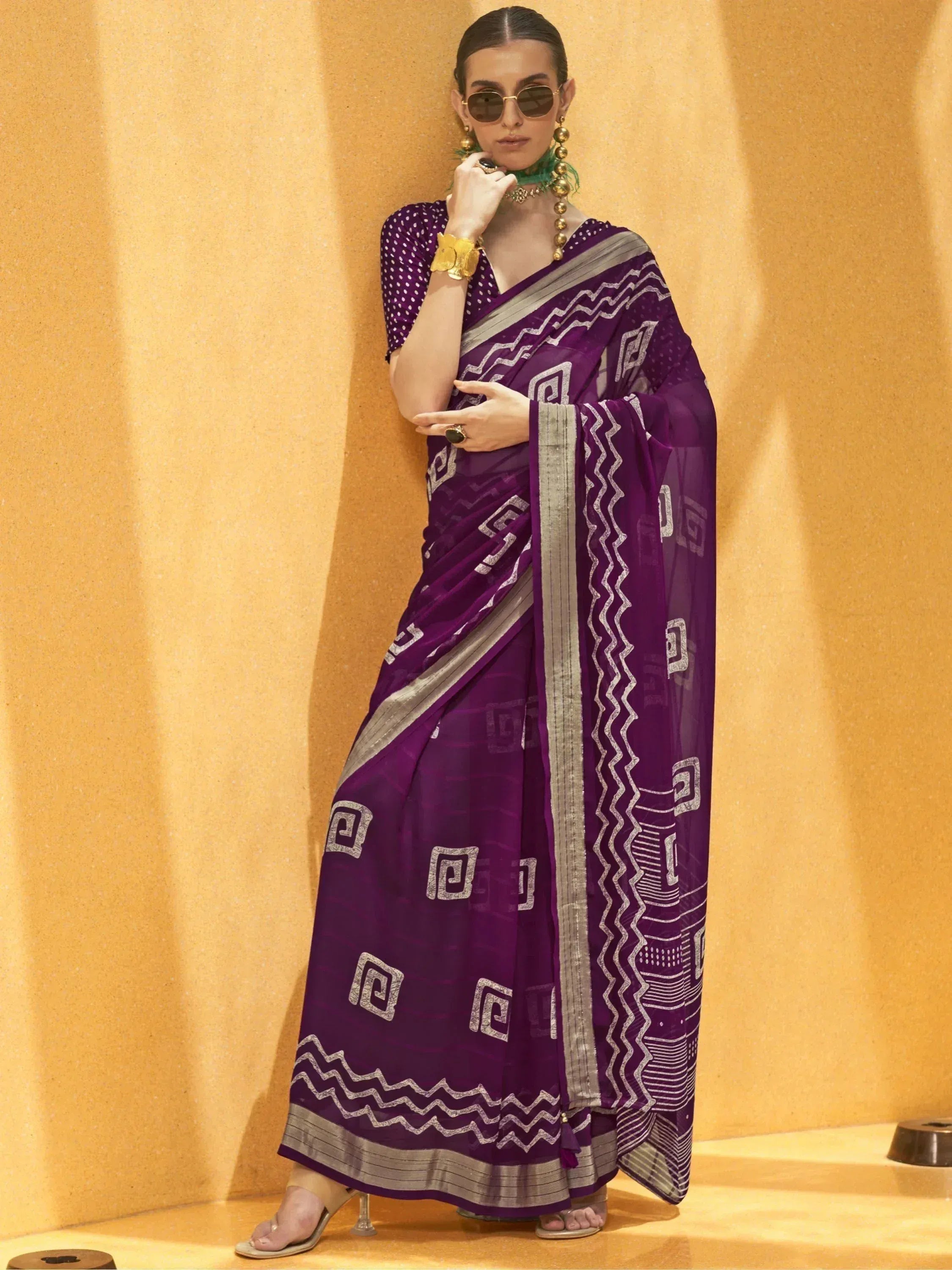 Purple ethnic saree with geometric print and silver border, paired with polka dot blouse for Indian occasions