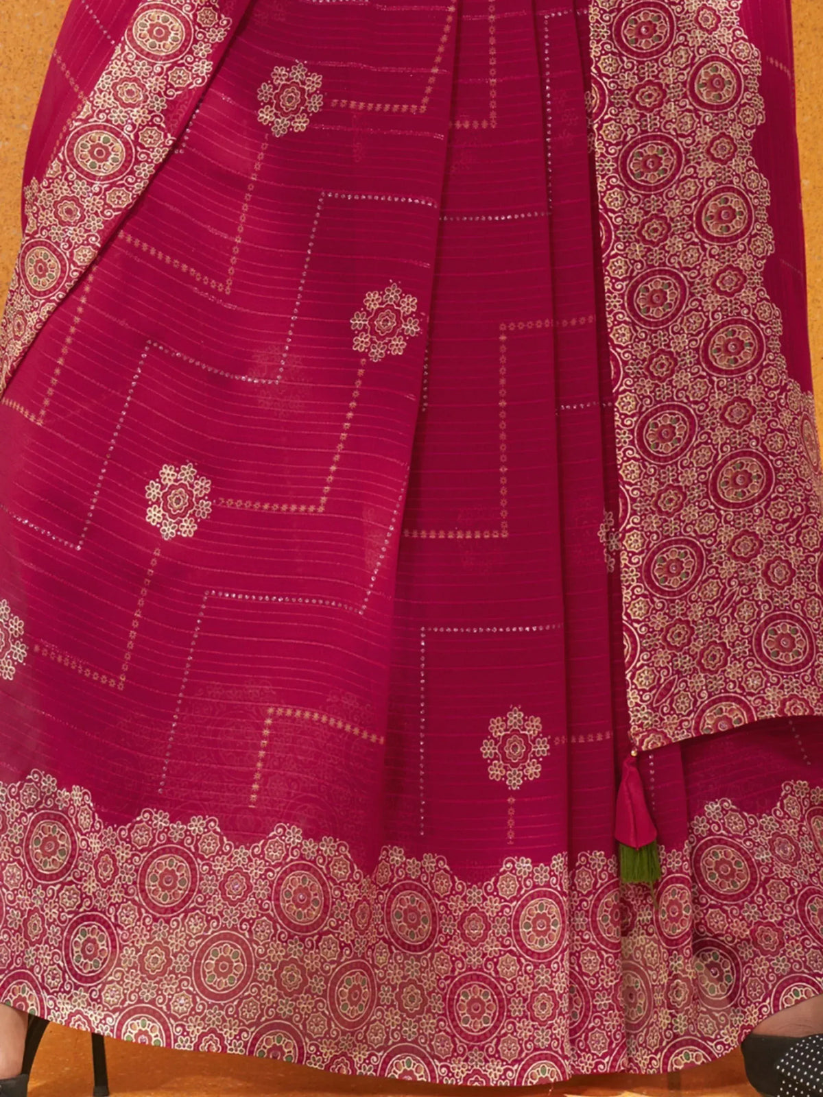 Rich maroon ethnic lehenga with intricate gold floral embroidery and border detailing, perfect for Indian weddings.