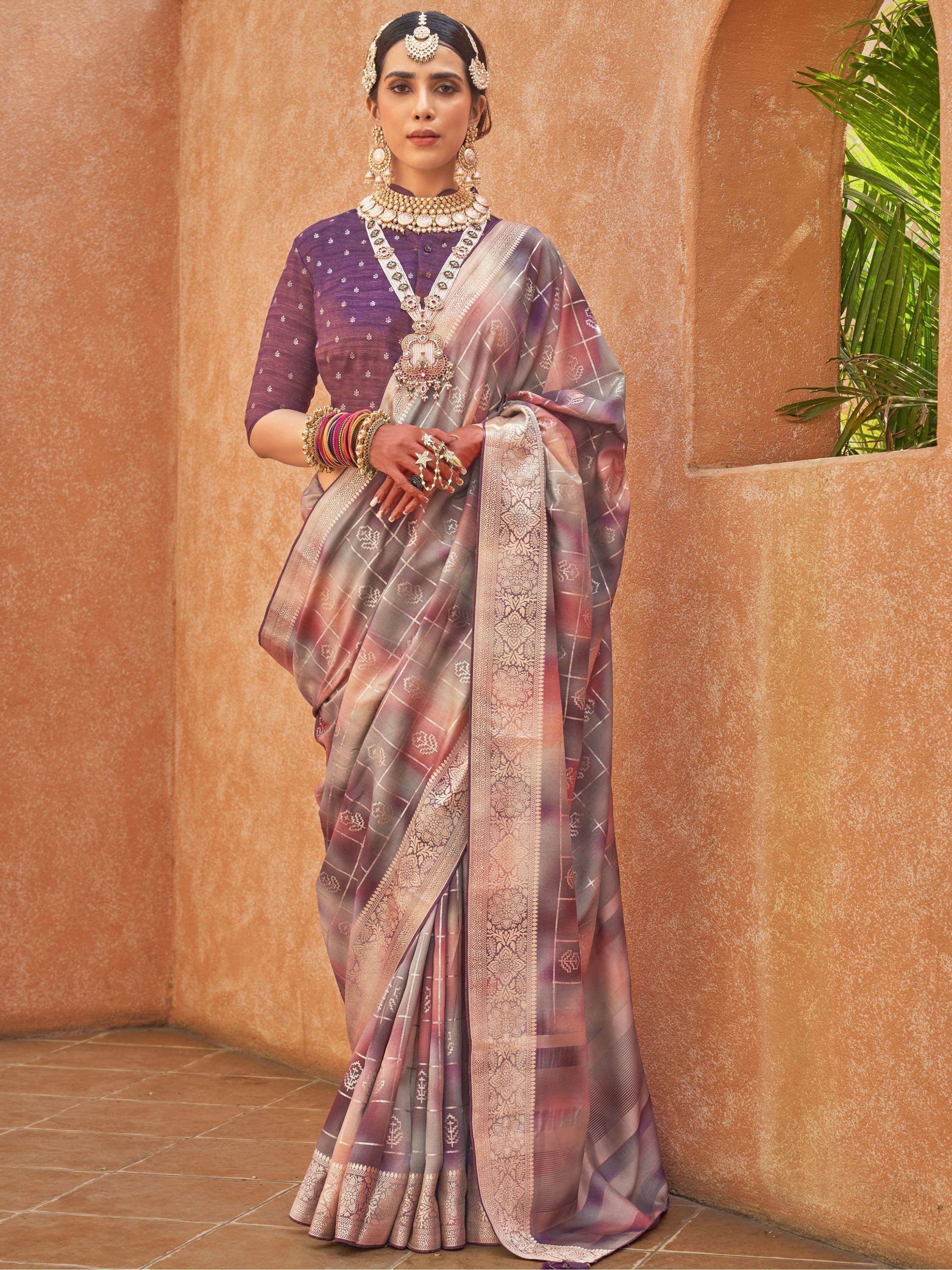 Elegant purple and pink designer saree with gold embroidery, perfect for Indian ethnic wear occasions
