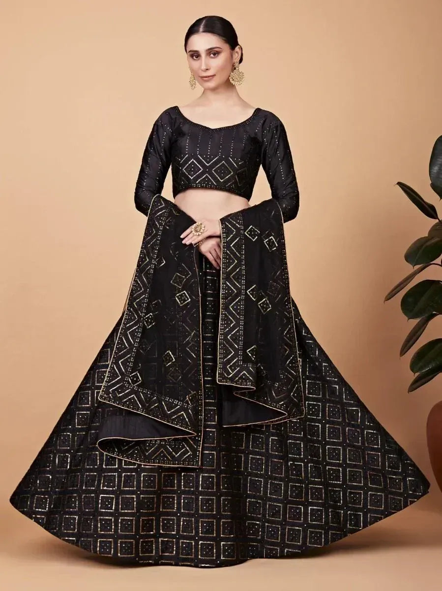 Black designer lehenga choli with gold geometric embroidery, perfect for weddings and parties