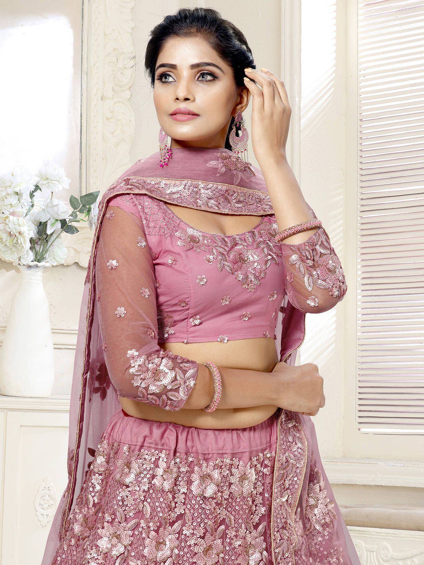 Pink embroidered lehenga choli with sheer sleeves and floral sequin work, perfect for Indian ethnic occasions