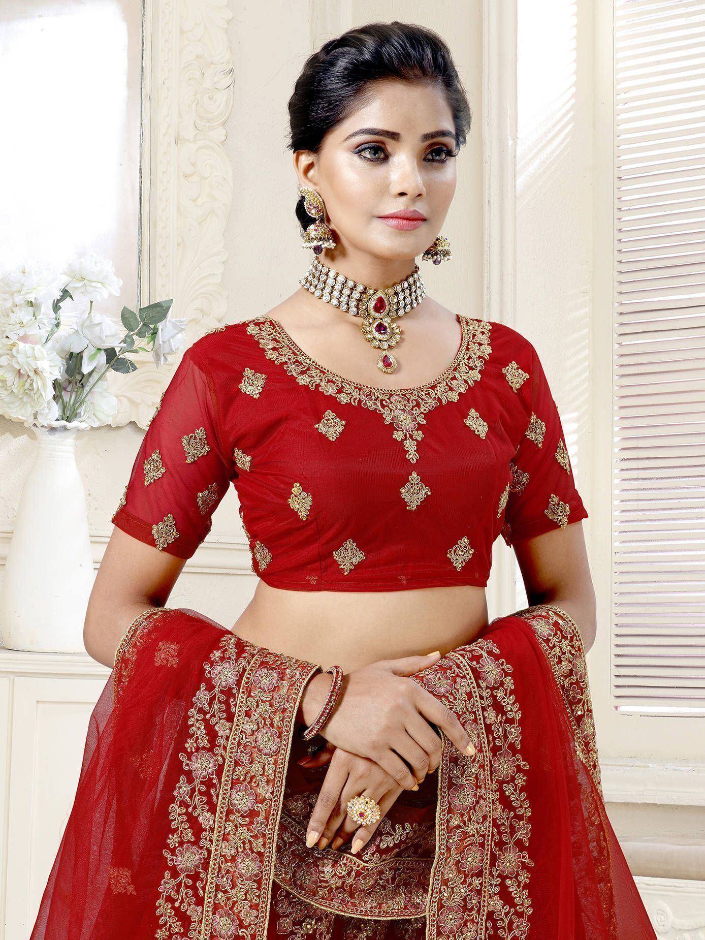 Red embroidered lehenga choli with gold detailing, perfect for Indian weddings and festive occasions