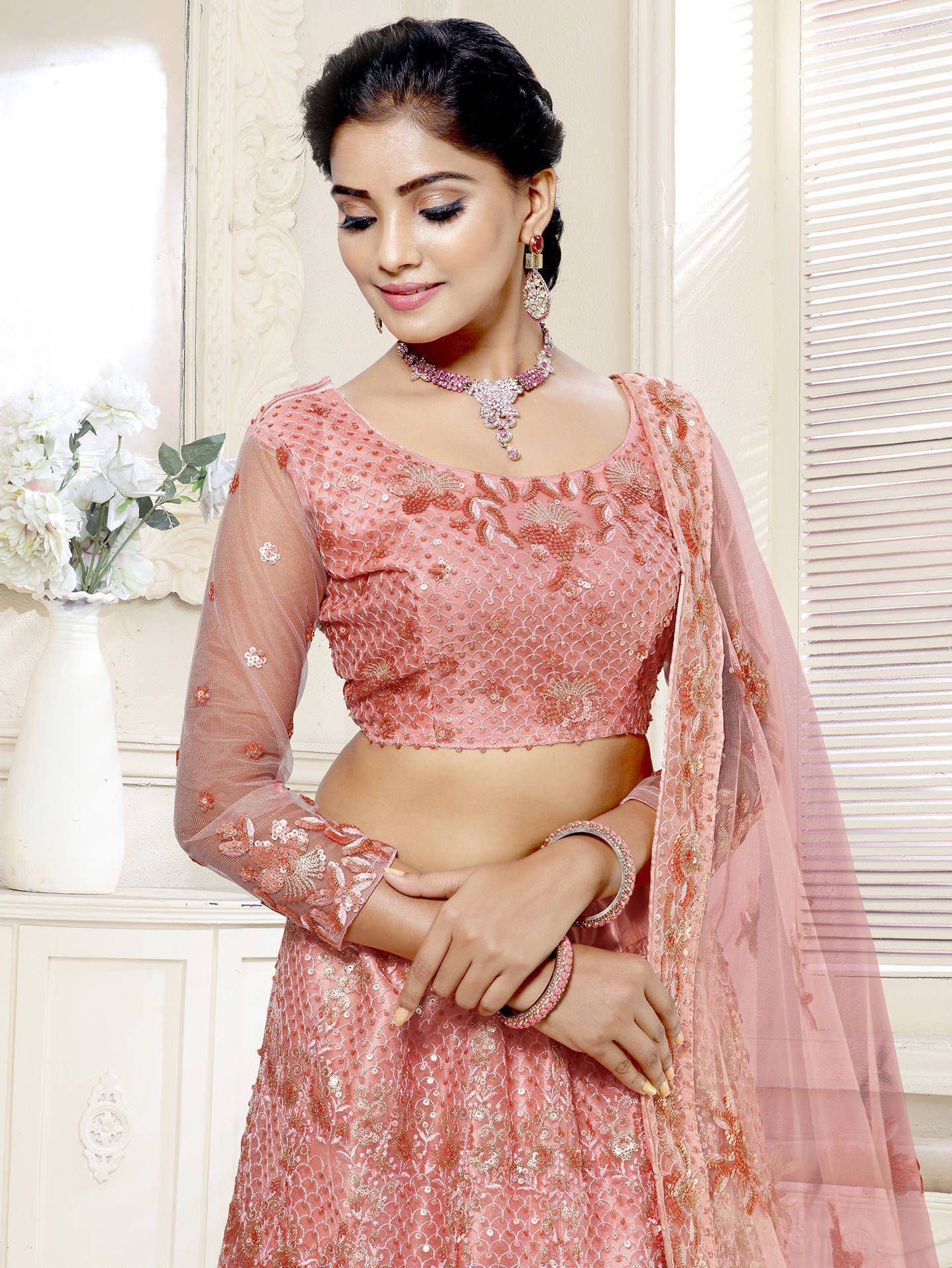 Pink embroidered lehenga choli with sheer sleeves and dupatta, perfect for Indian ethnic wear occasions