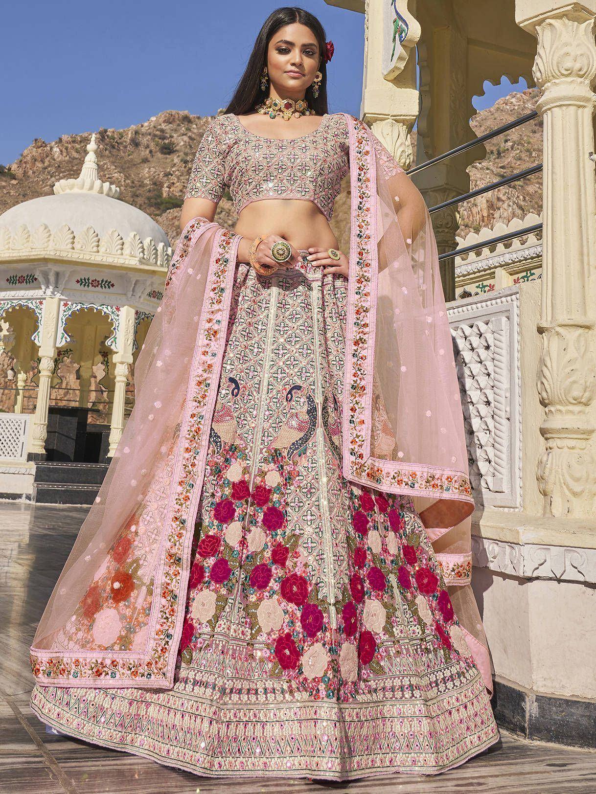 Pink floral embroidered lehenga choli with peacock motifs, perfect for Indian weddings and festive occasions.