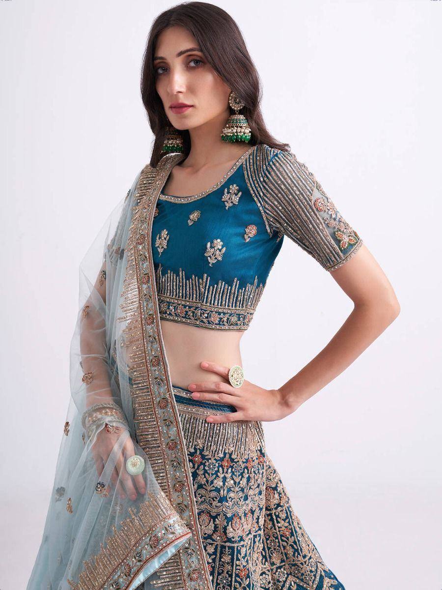 Teal embroidered lehenga choli with sheer dupatta, perfect for Indian ethnic wear occasions