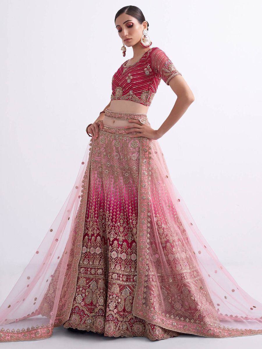 Pink and red embroidered lehenga choli with gold detailing, perfect for Indian weddings and festive occasions
