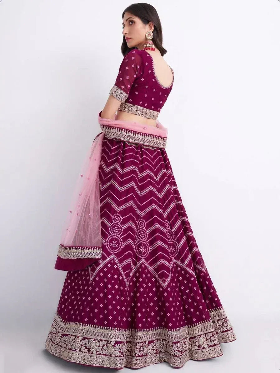 Maroon lehenga choli with white embroidery and pink dupatta, ethnic Indian wedding wear
