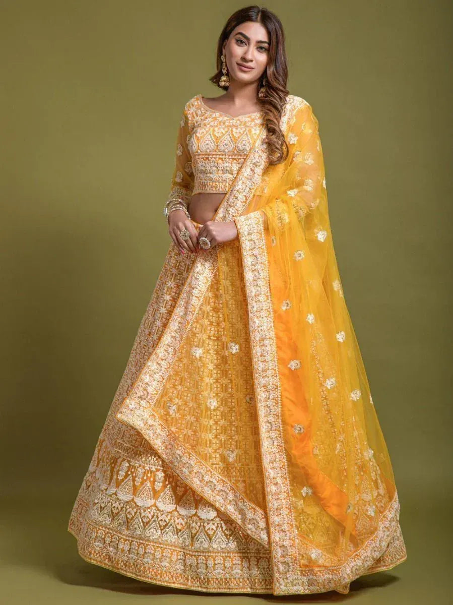 Yellow embroidered lehenga choli with matching dupatta, perfect for Indian weddings and festive occasions
