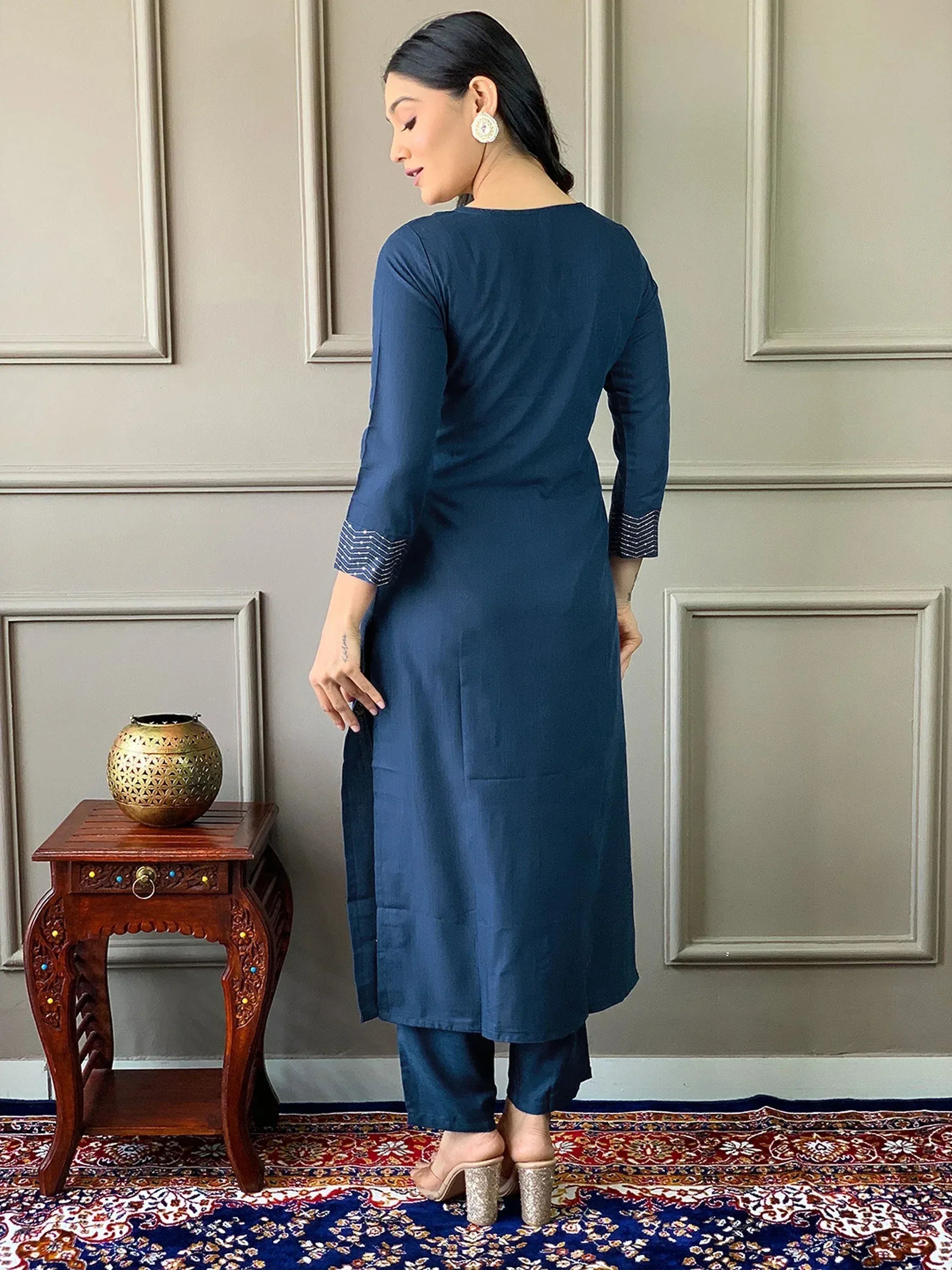 Navy blue ethnic kurta with striped cuffs, paired with matching pants, styled for Indian wear