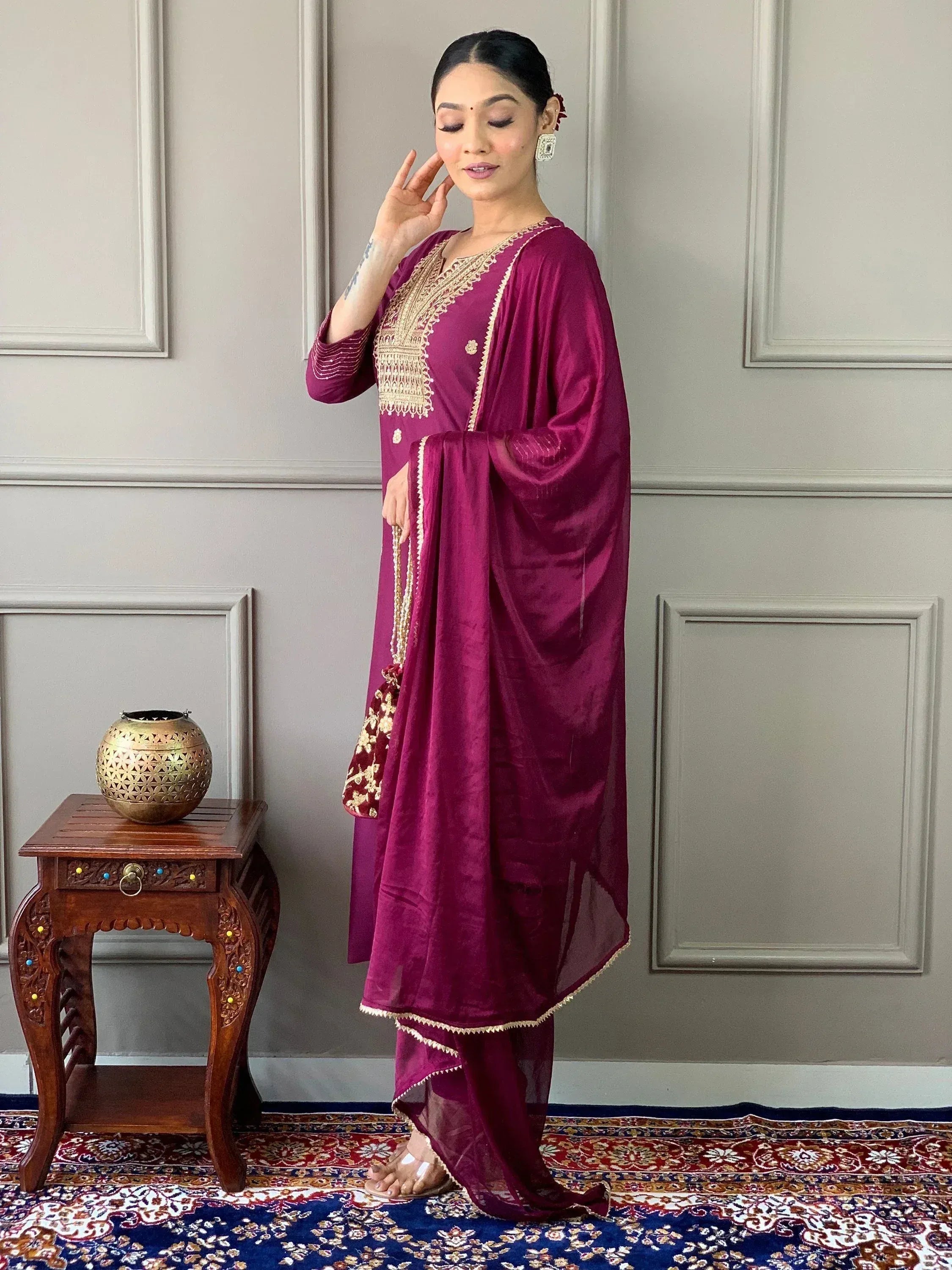 Elegant maroon velvet salwar kameez with gold embroidery, perfect for Indian ethnic wear occasions.