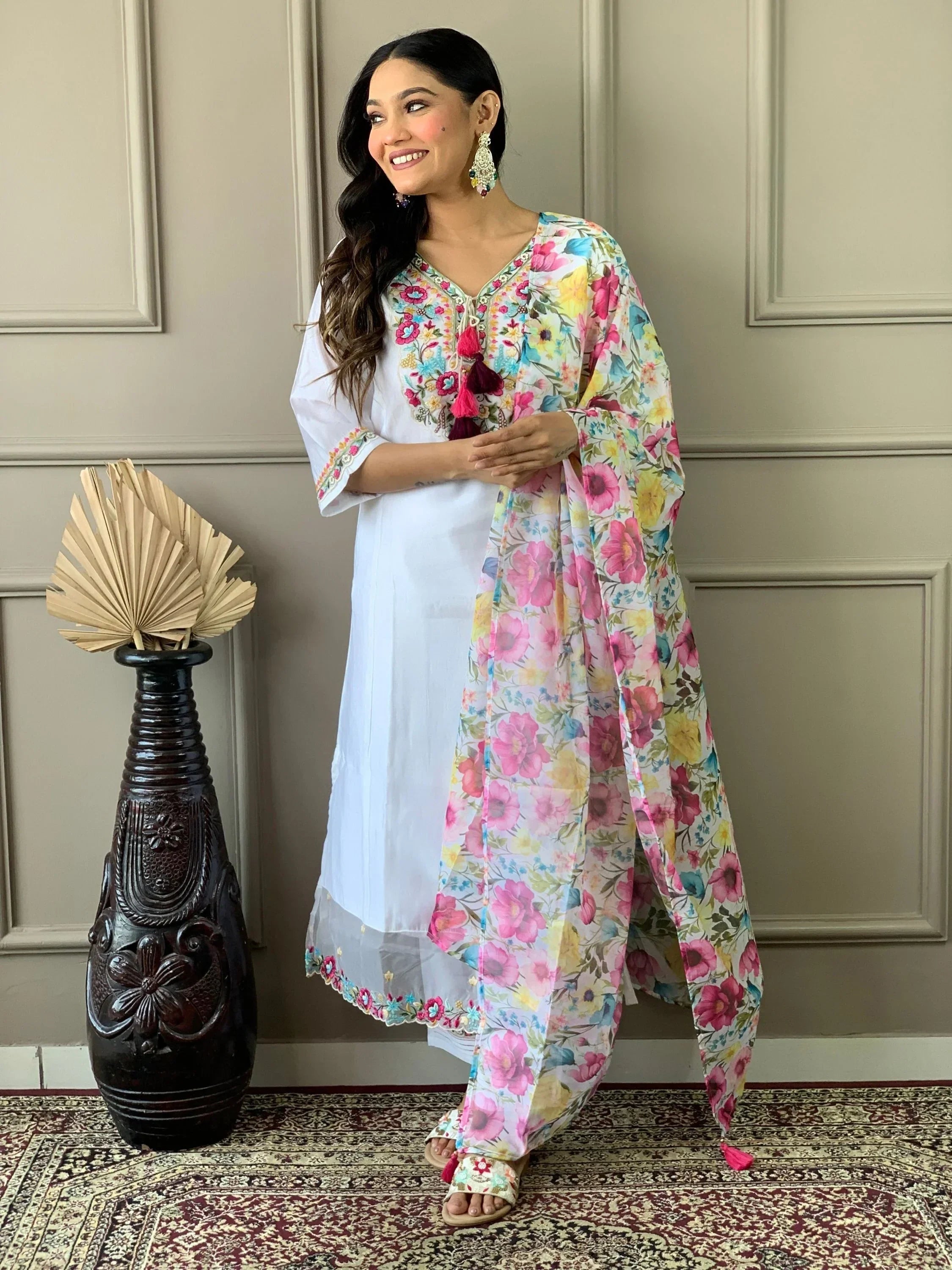 Woman in white embroidered salwar kameez with floral dupatta, Indian ethnic wear fashion