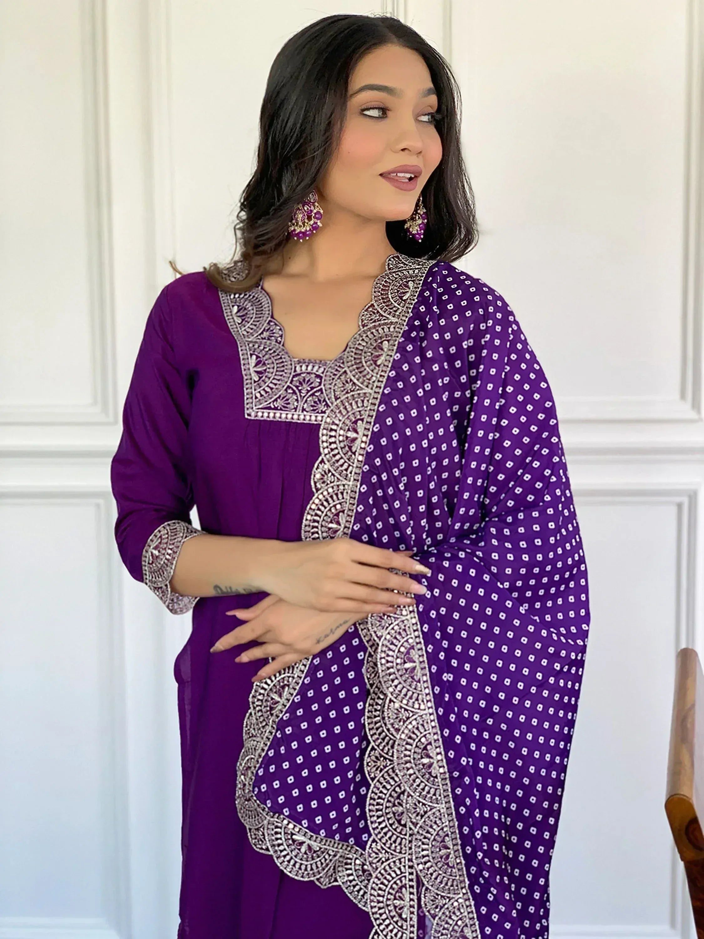 Purple ethnic kurti with silver embroidery and printed dupatta, styled with statement earrings