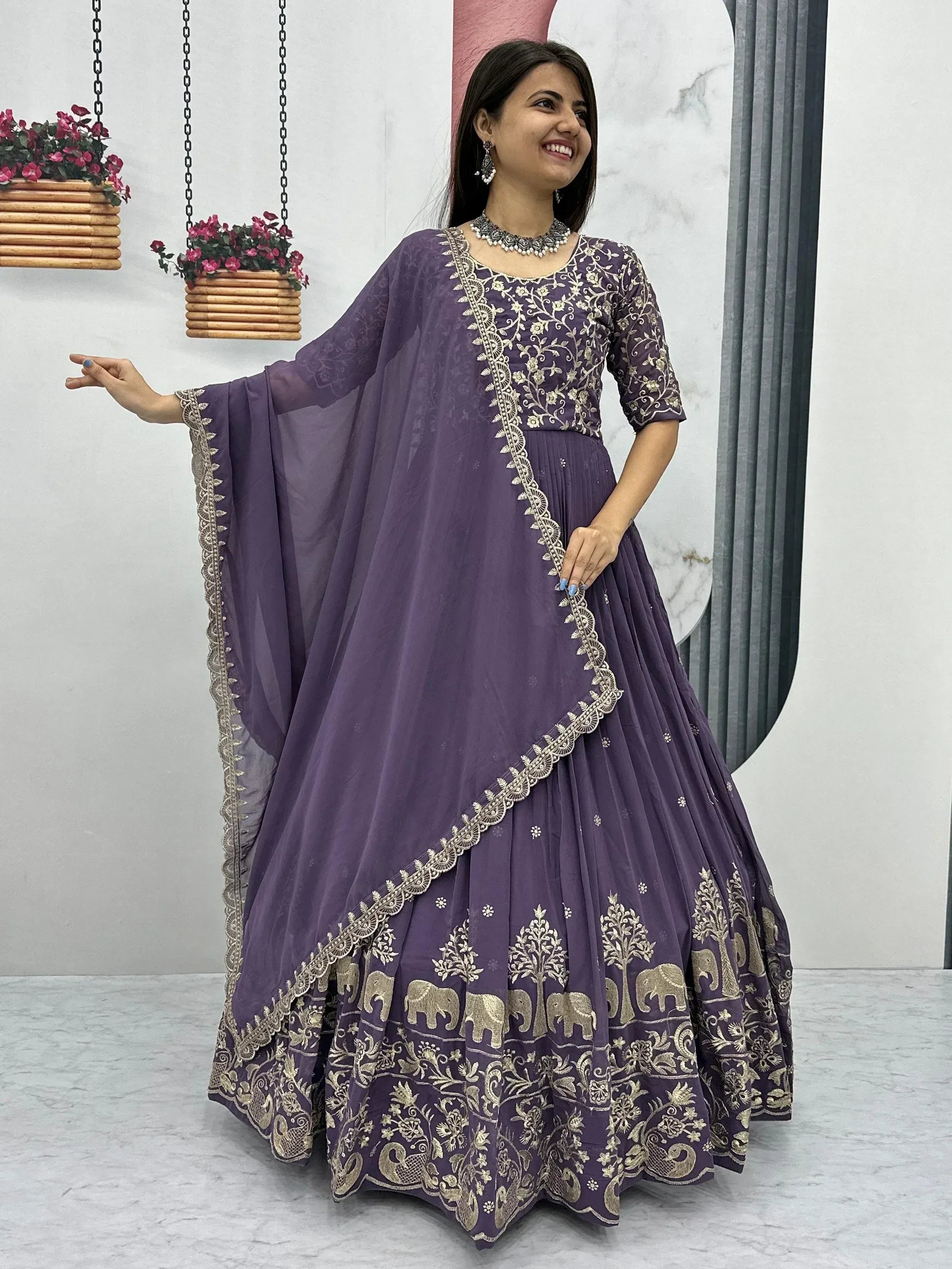 Purple embroidered lehenga choli with elephant and tree motifs, perfect for Indian ethnic wear occasions.
