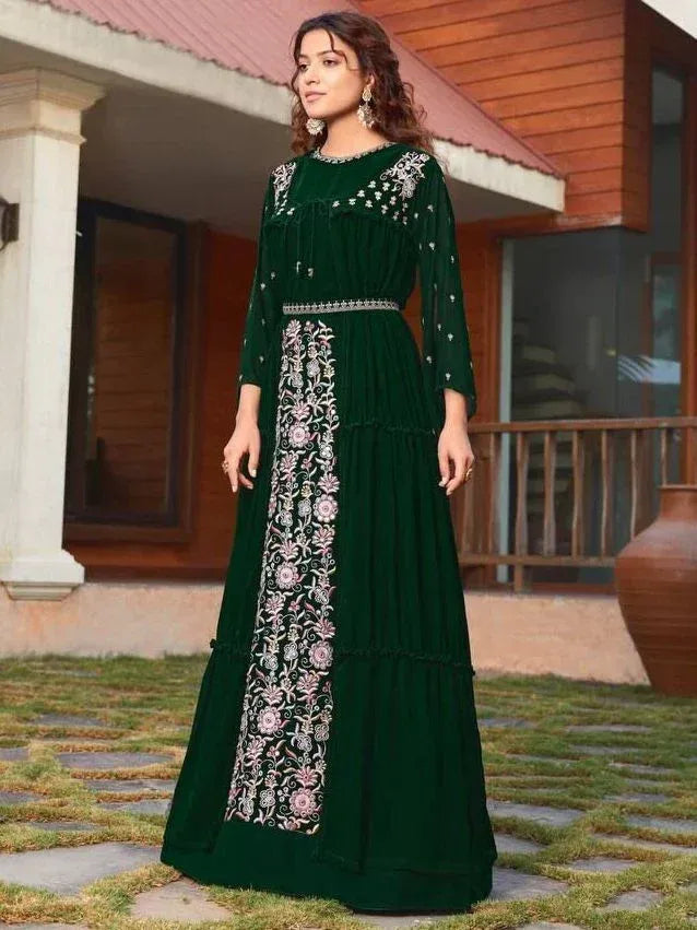 Emerald green ethnic gown with floral embroidery, perfect for Indian occasions and festive wear.