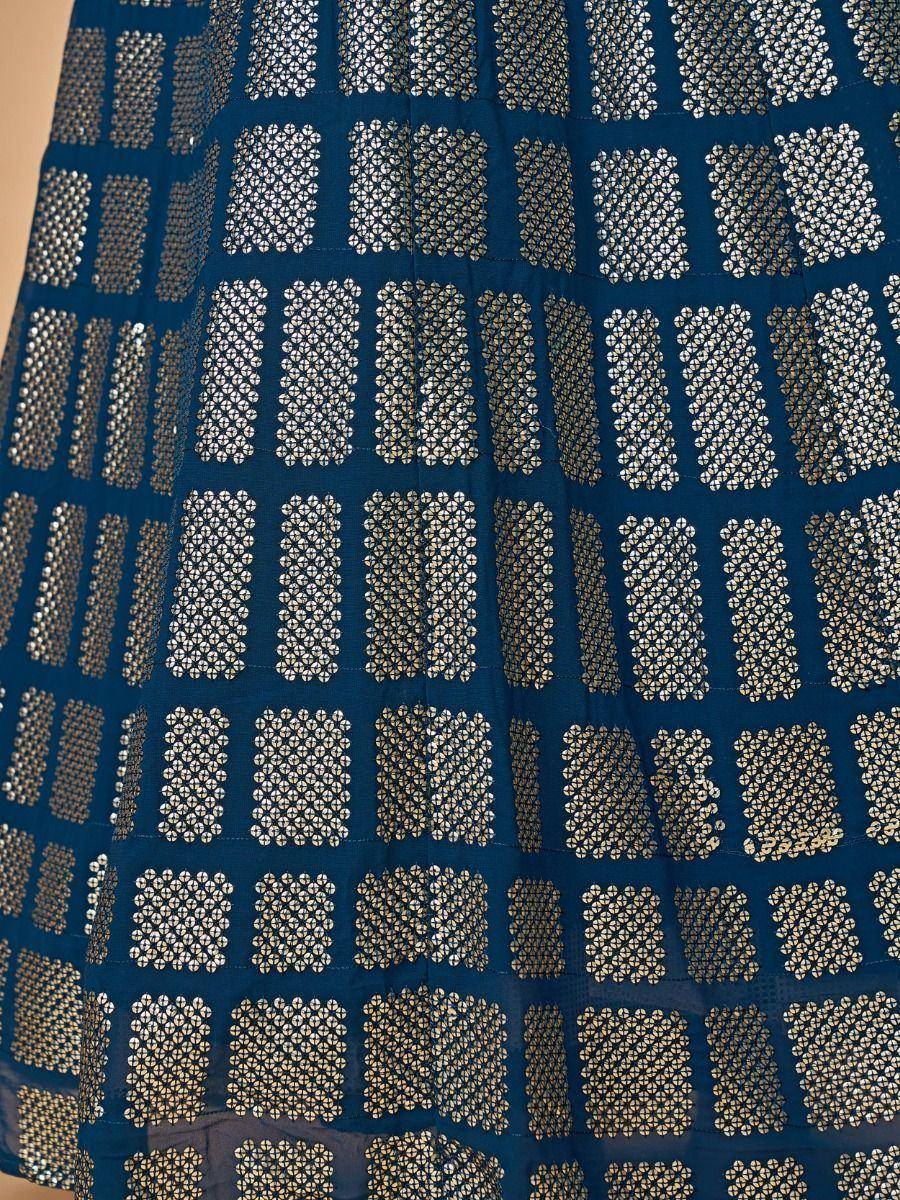 Blue ethnic gown with gold and silver geometric block print pattern, perfect for Indian occasions