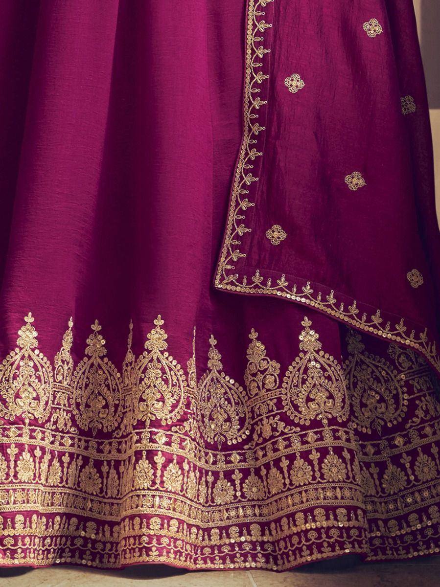 Rich maroon lehenga with intricate gold embroidery and scalloped border, perfect for Indian ethnic wear