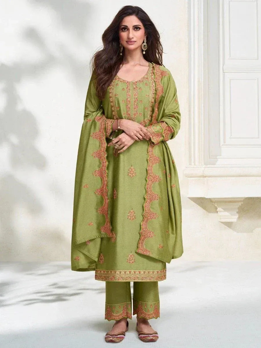 Green embroidered salwar kameez with matching pants and dupatta, ideal for Indian ethnic wear occasions.