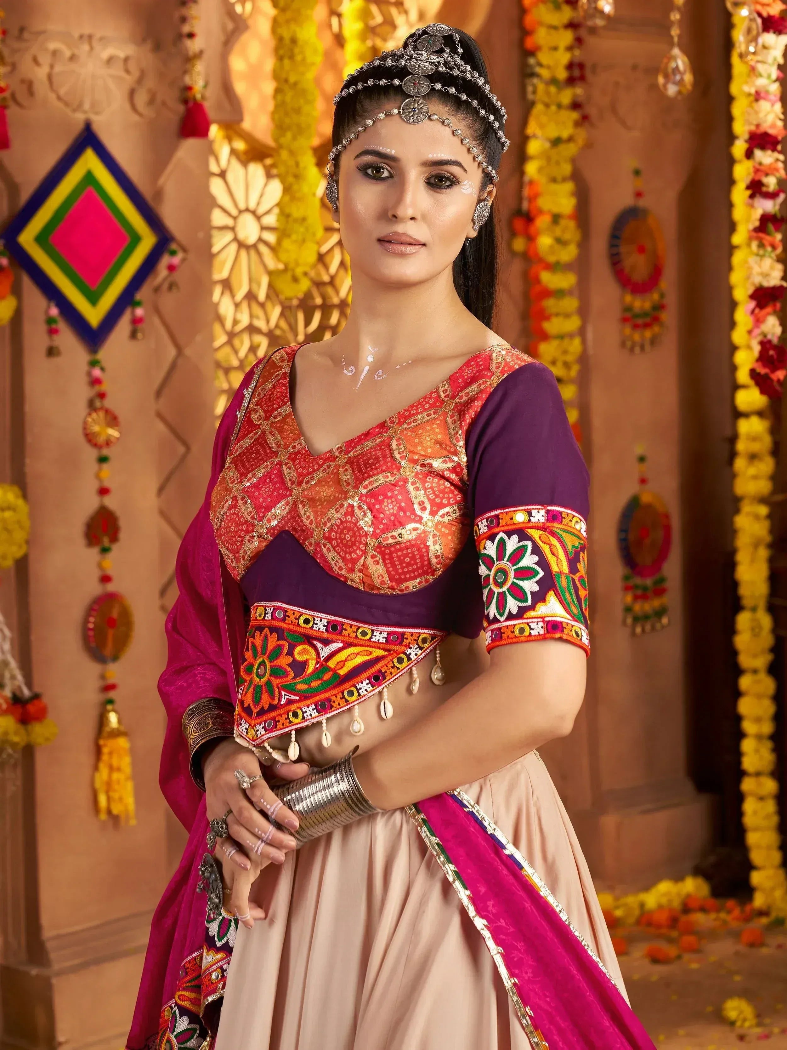 Vibrant Indian ethnic wear with embroidered blouse and floral dupatta, perfect for festive occasions.