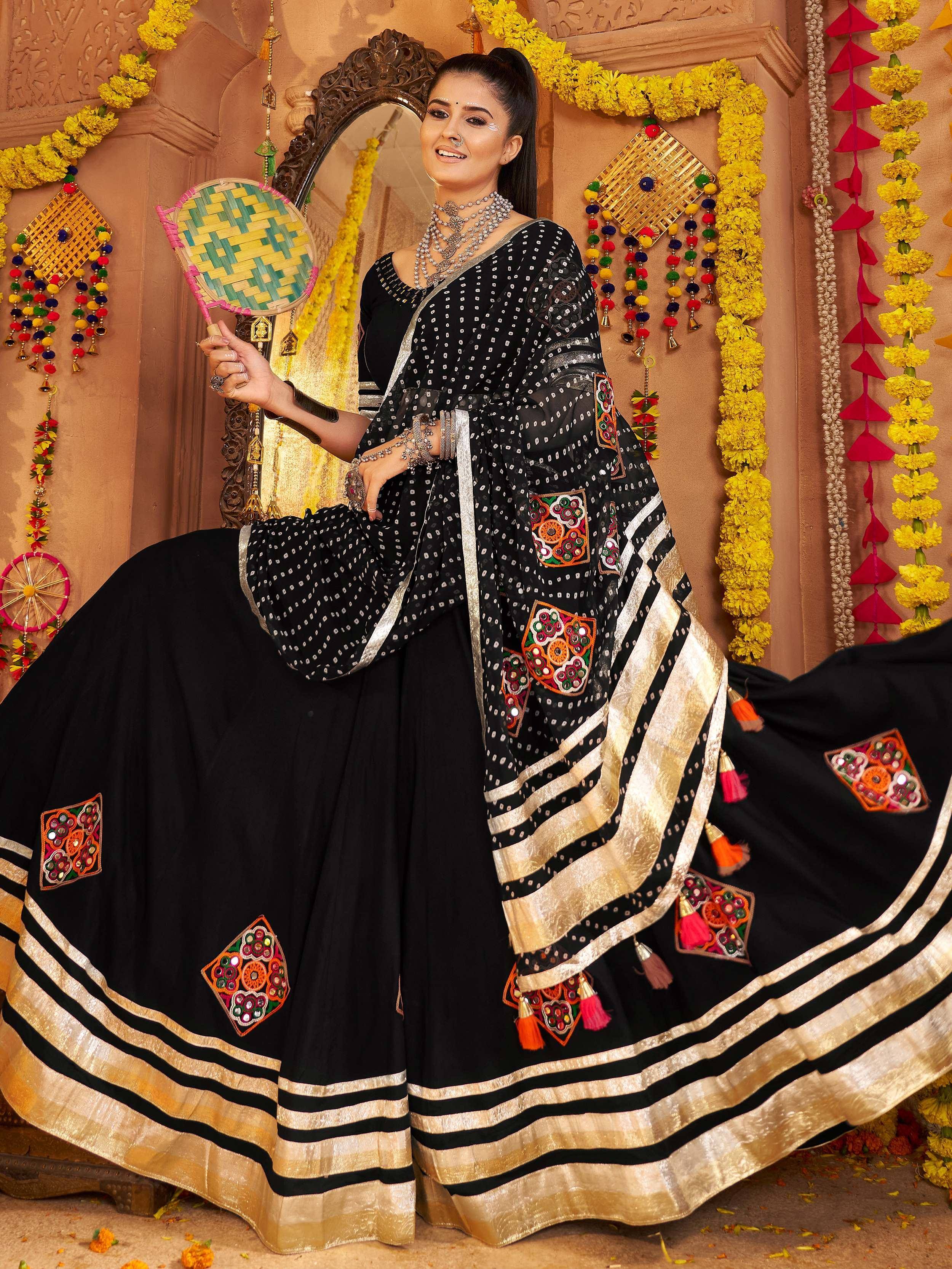 Black embroidered ethnic gown with gold border, perfect for Indian festivals and weddings