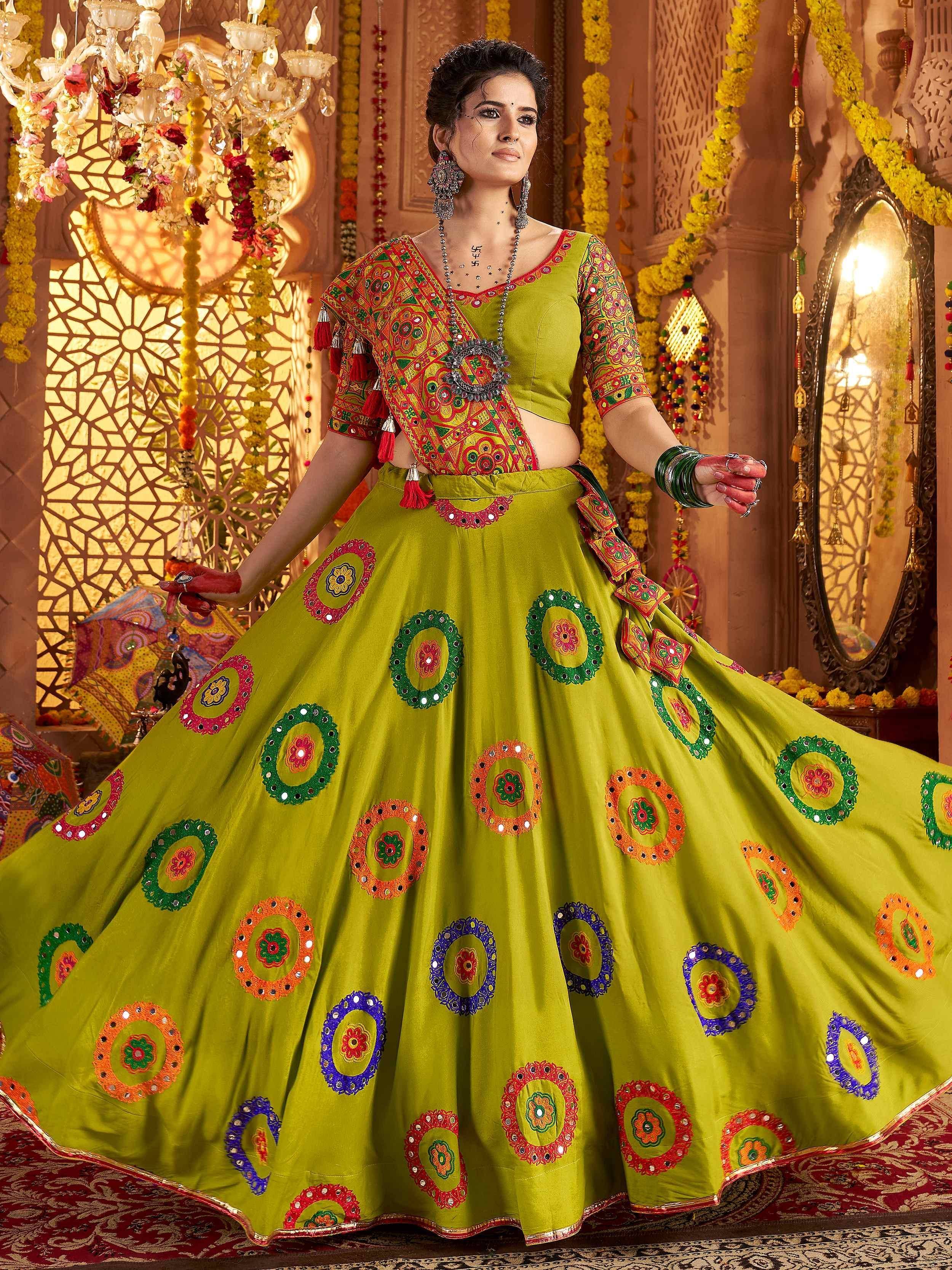 Vibrant green lehenga choli with colorful mirror work, perfect for Indian ethnic wear and festive occasions.